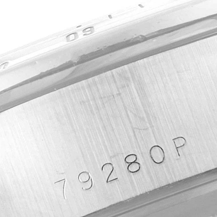 This close-up shows the side of a Tudor Prince model 79280P, focusing on its case details and serial number engraving.