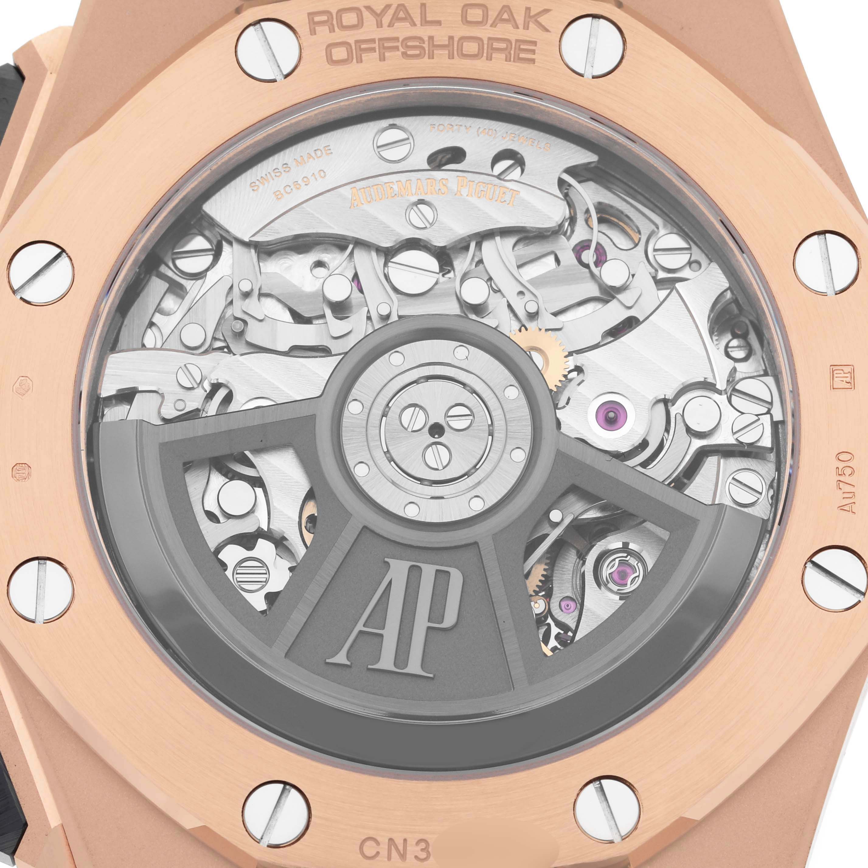 The image shows the back of an Audemars Piguet Royal Oak Offshore 26420RO.OO.A002CA.01 Men's Rose Gold Black Dial 26420RO.OO.A002CA.01 Men's Rose Gold Black Dial watch, highlighting the visible movement and rotor.