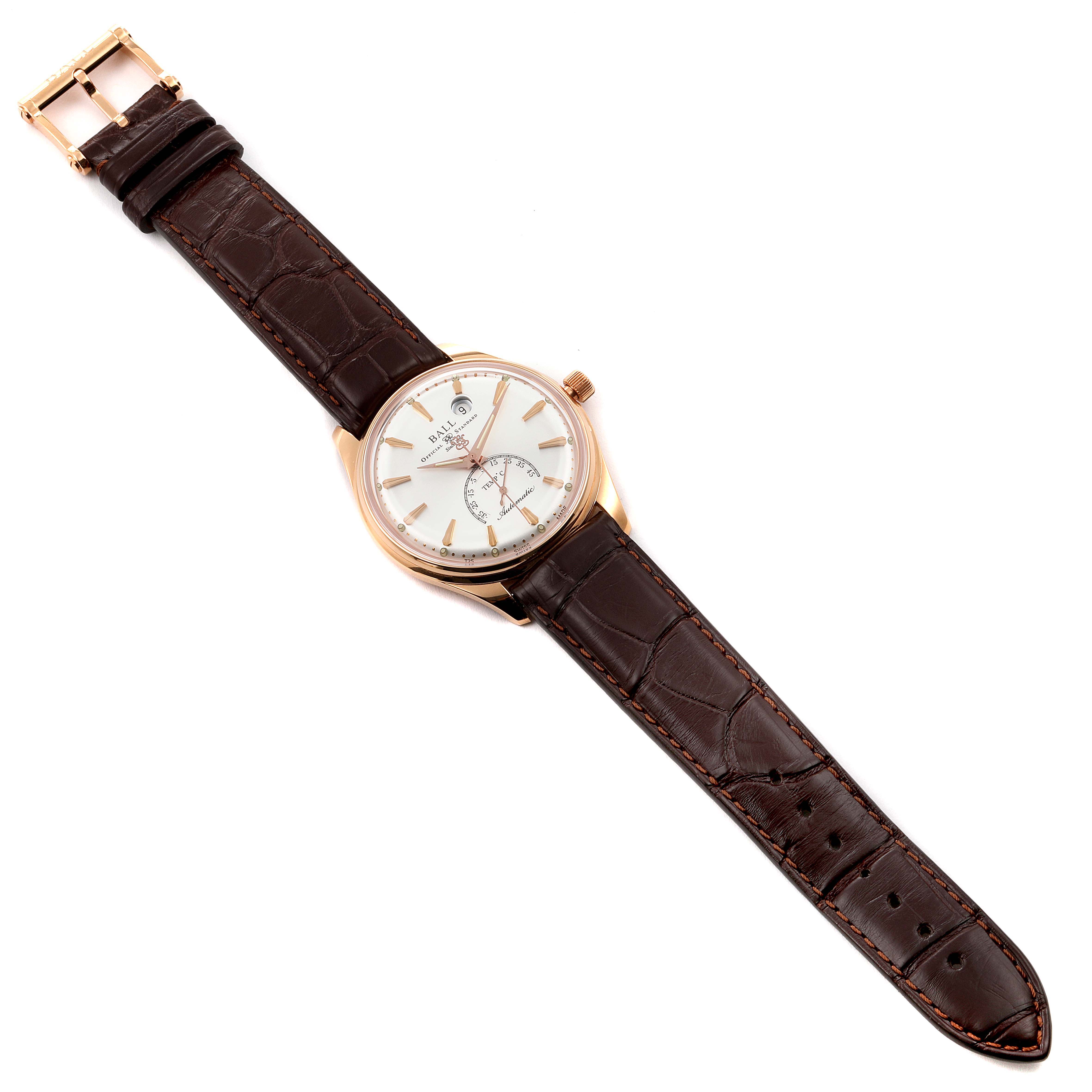 The Ball Trainmaster NT3888P Men's Rose Gold Silver Dial NT3888P Men's Rose Gold Silver Dial watch is shown from a top-down angle, displaying the face, crown, and entire leather strap.