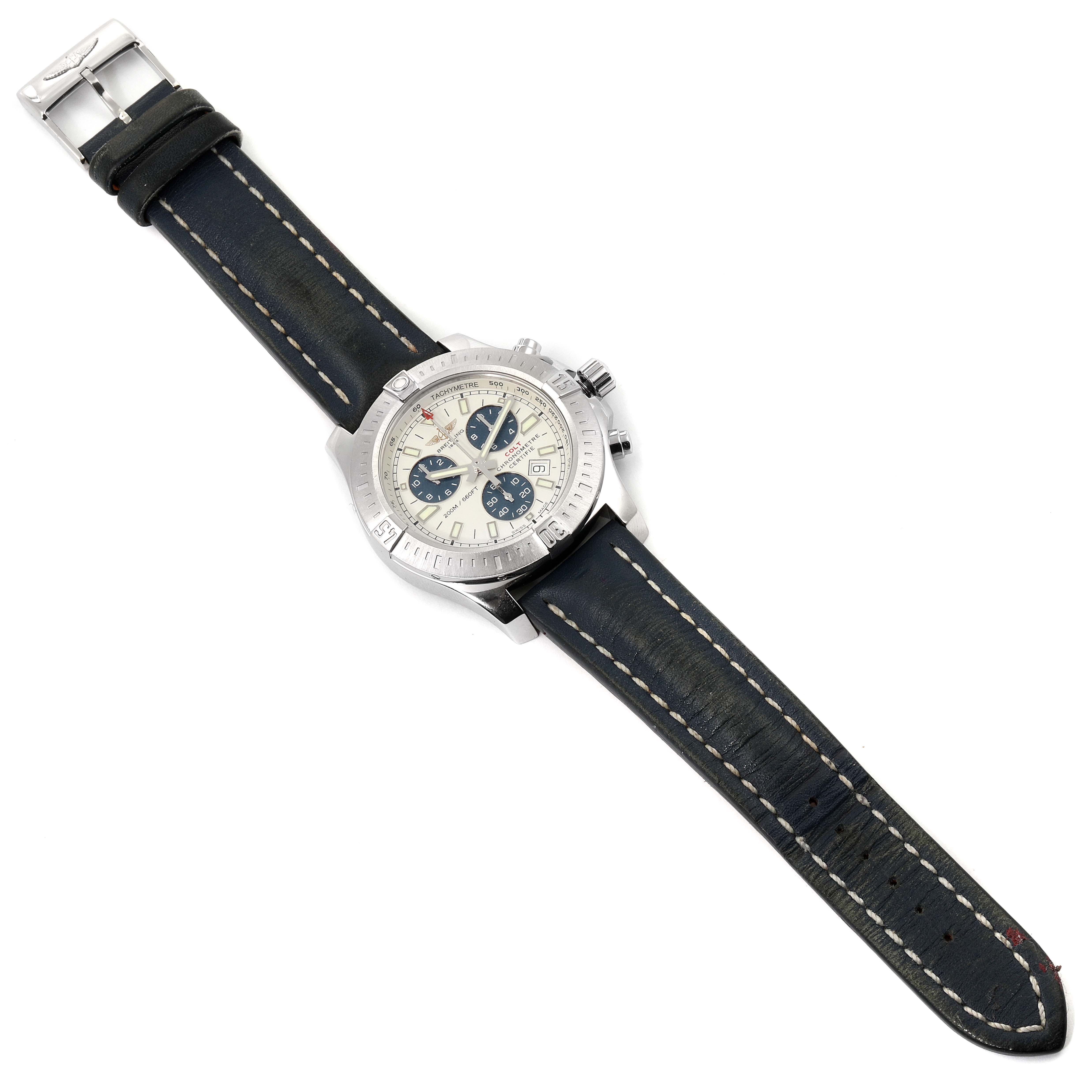 The Breitling Colt A73388 Men's Stainless Steel White Dial A73388 Men's Stainless Steel White Dial watch is shown fully extended, face-up, revealing its dial, bezel, buttons, and leather strap.