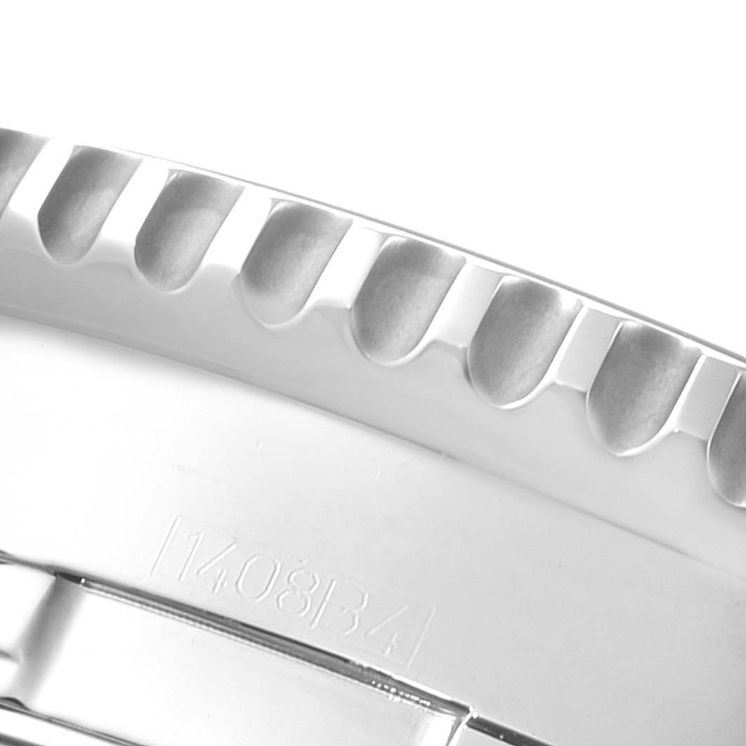 The image shows a close-up angle of the bezel and part of the bracelet of the Breitling Navitimer A24322 Men's Stainless Steel Silver Dial A24322 Men's Stainless Steel Silver Dial watch.