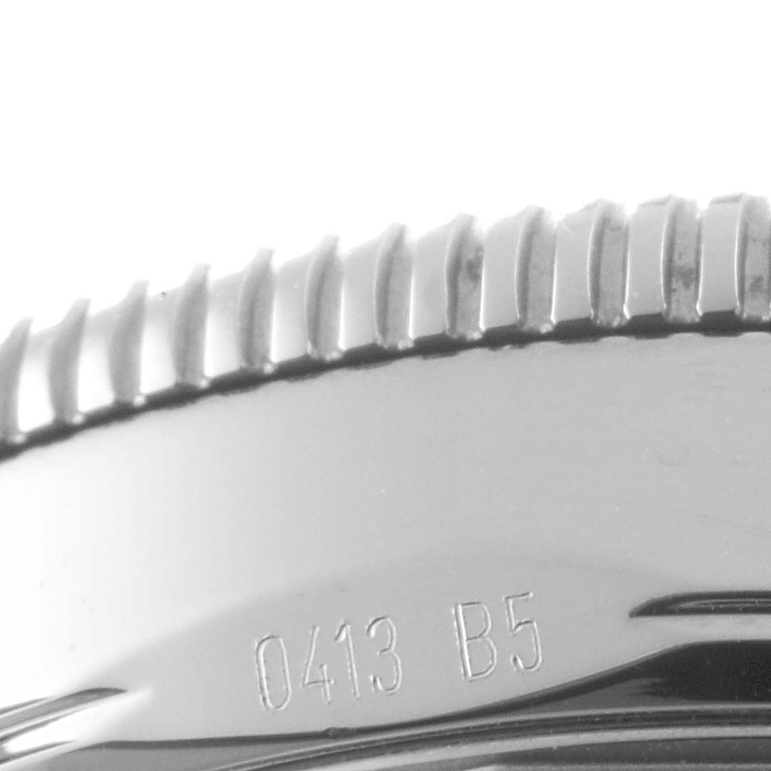This image shows the engraved bezel and outer edge of the case back of a Breitling Superocean A17321 Men's Stainless Steel Black Dial A17321 Men's Stainless Steel Black Dial watch.