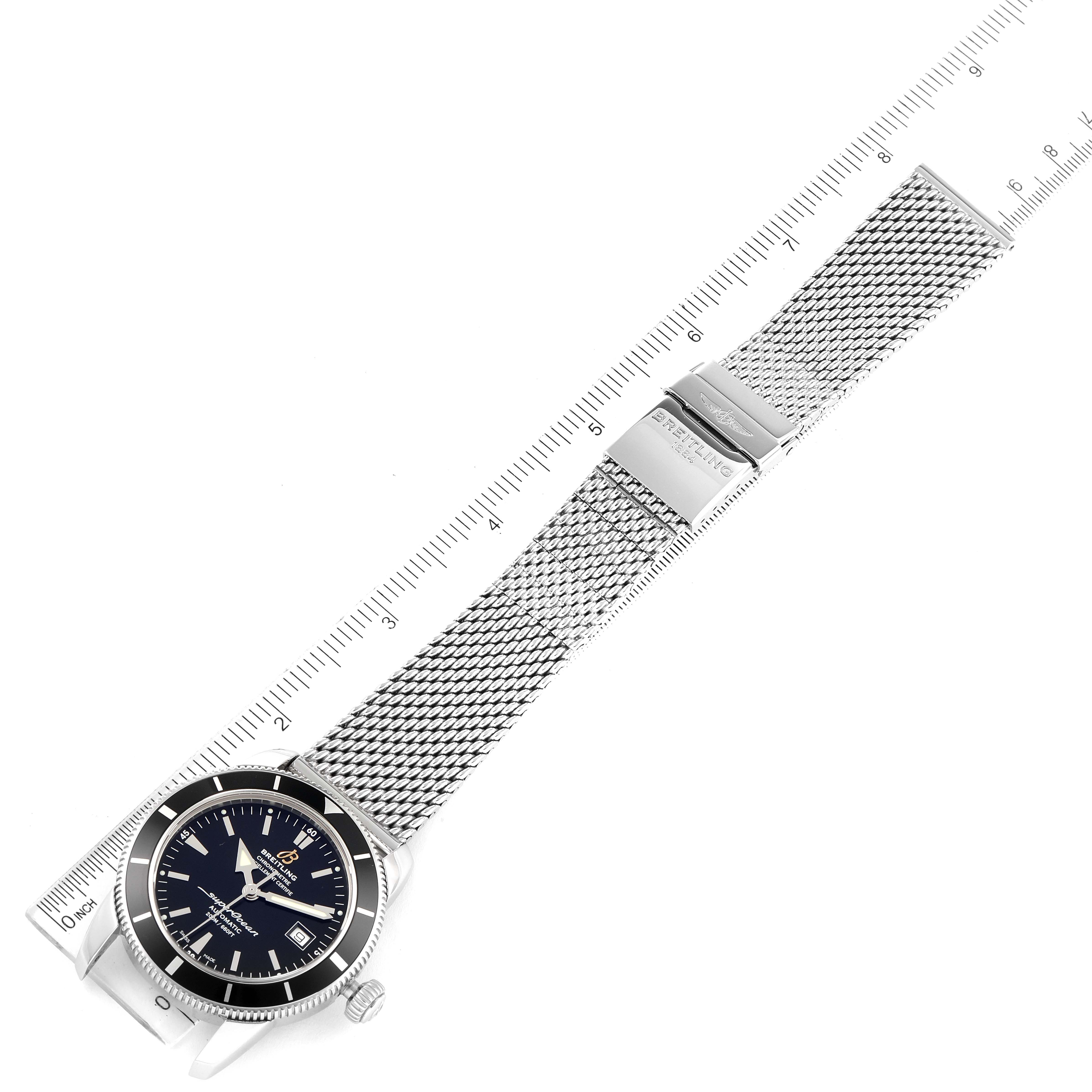 The image shows a Breitling Superocean A17321 Men's Stainless Steel Black Dial A17321 Men's Stainless Steel Black Dial watch laid flat with its mesh strap fully extended, including a ruler for scale.