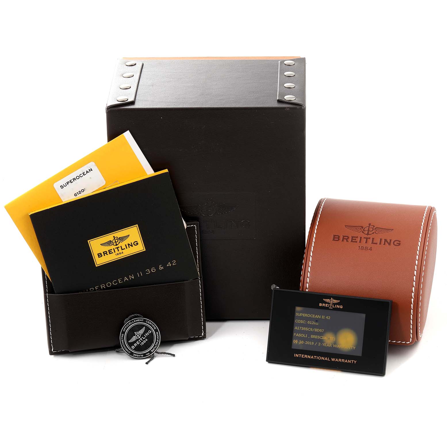 This image shows the packaging, warranty cards, manuals, and accessories for the Breitling Superocean A17365 Men's Stainless Steel Black Dial A17365 Men's Stainless Steel Black Dial watch model.