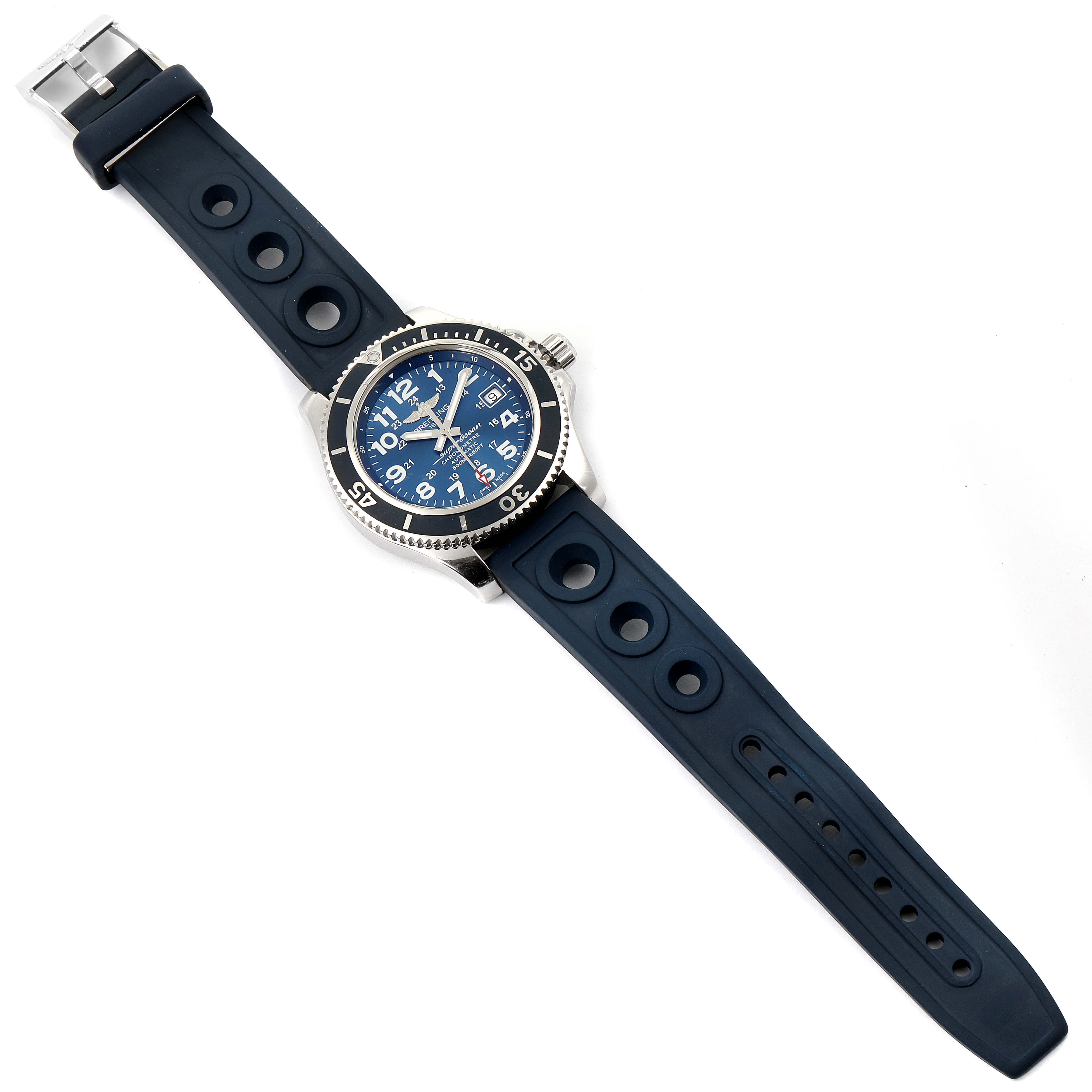 The image shows a Breitling Superocean A17365 Men's Stainless Steel Blue Dial A17365 Men's Stainless Steel Blue Dial watch from a top-down angle, highlighting the face, bezel, and rubber strap with holes.