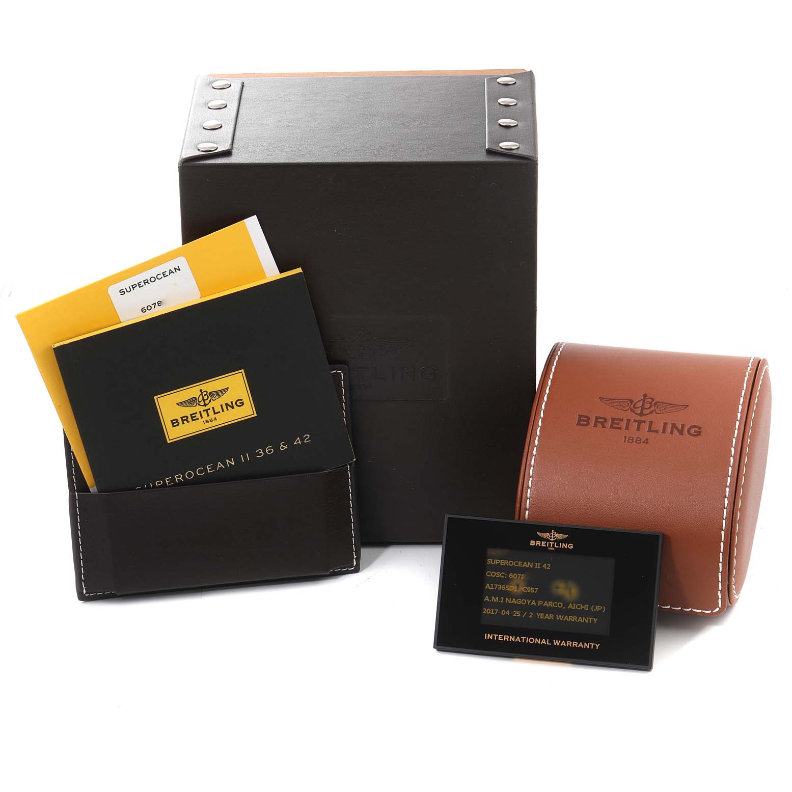 The image shows the packaging, manuals, warranty card, and protective case for a Breitling Superocean A17365 Men's Stainless Steel Blue Dial A17365 Men's Stainless Steel Blue Dial watch.