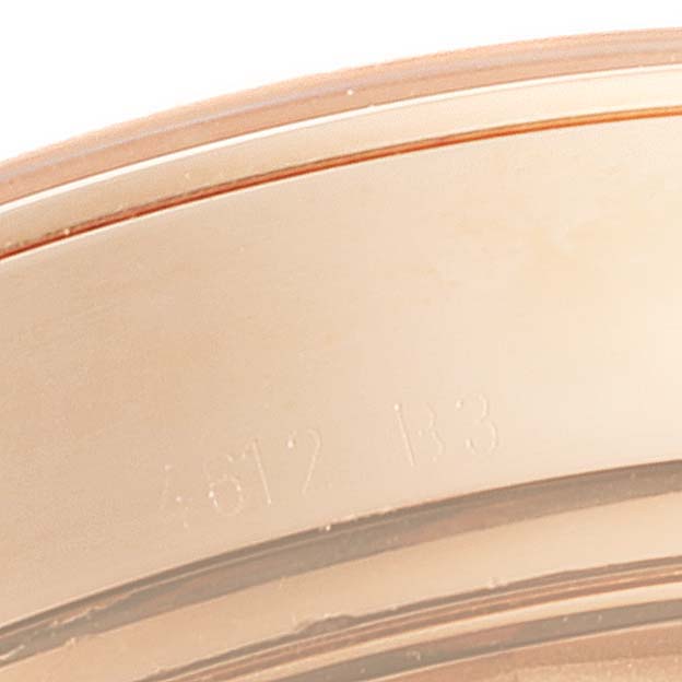 This close-up image displays the edge of the casing for a Breitling Transocean RB0152 Men
s Rose Gold Silver Dial RB0152 Men
s Rose Gold Silver Dial watch, showing the bezel and faint engraved markings.