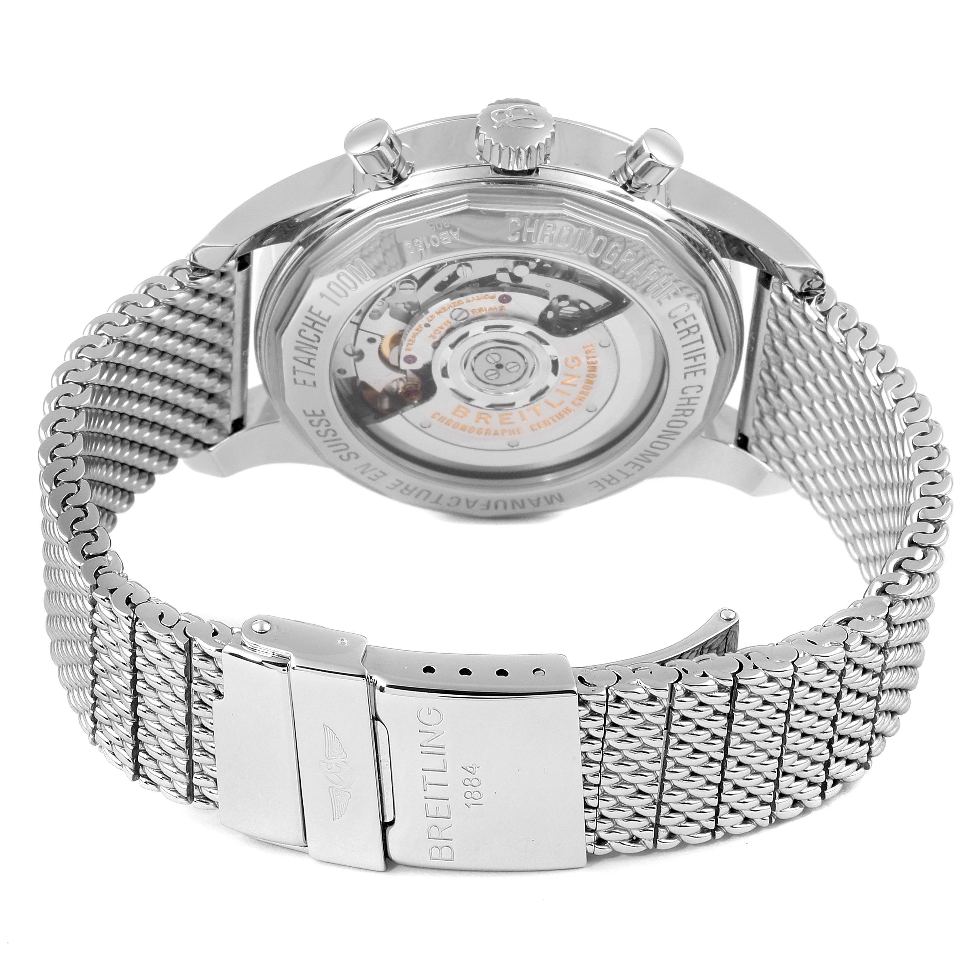 The image shows the back view of the Breitling Transocean AB015212/G724 Men
s Stainless Steel Silver Dial AB015212/G724 Men
s Stainless Steel Silver Dial watch, highlighting its transparent case back and steel mesh bracelet.