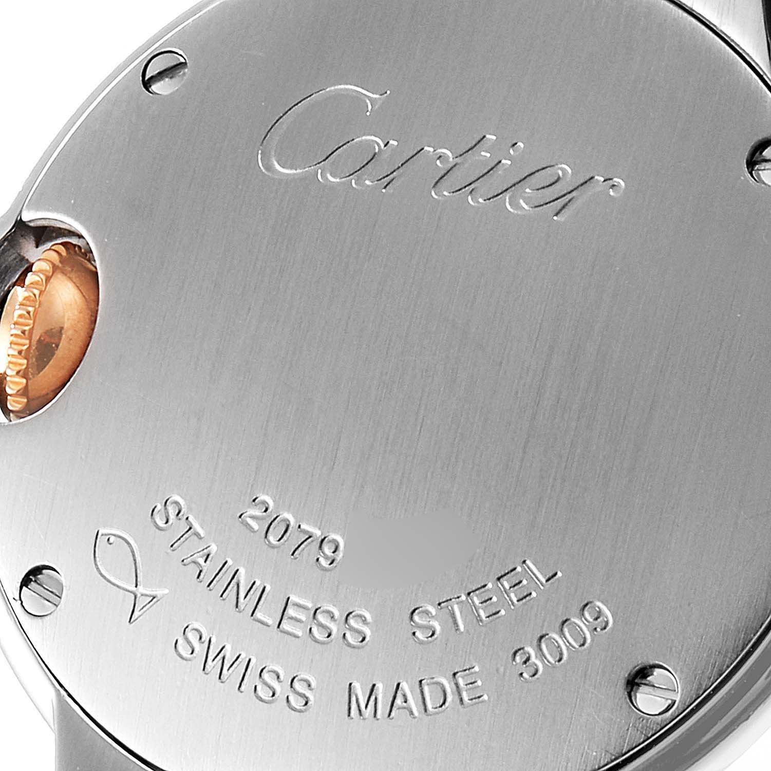 The image shows the back of a Ballon Bleu model watch by Cartier, displaying the engraved brand name, material, and Swiss manufacturing details.