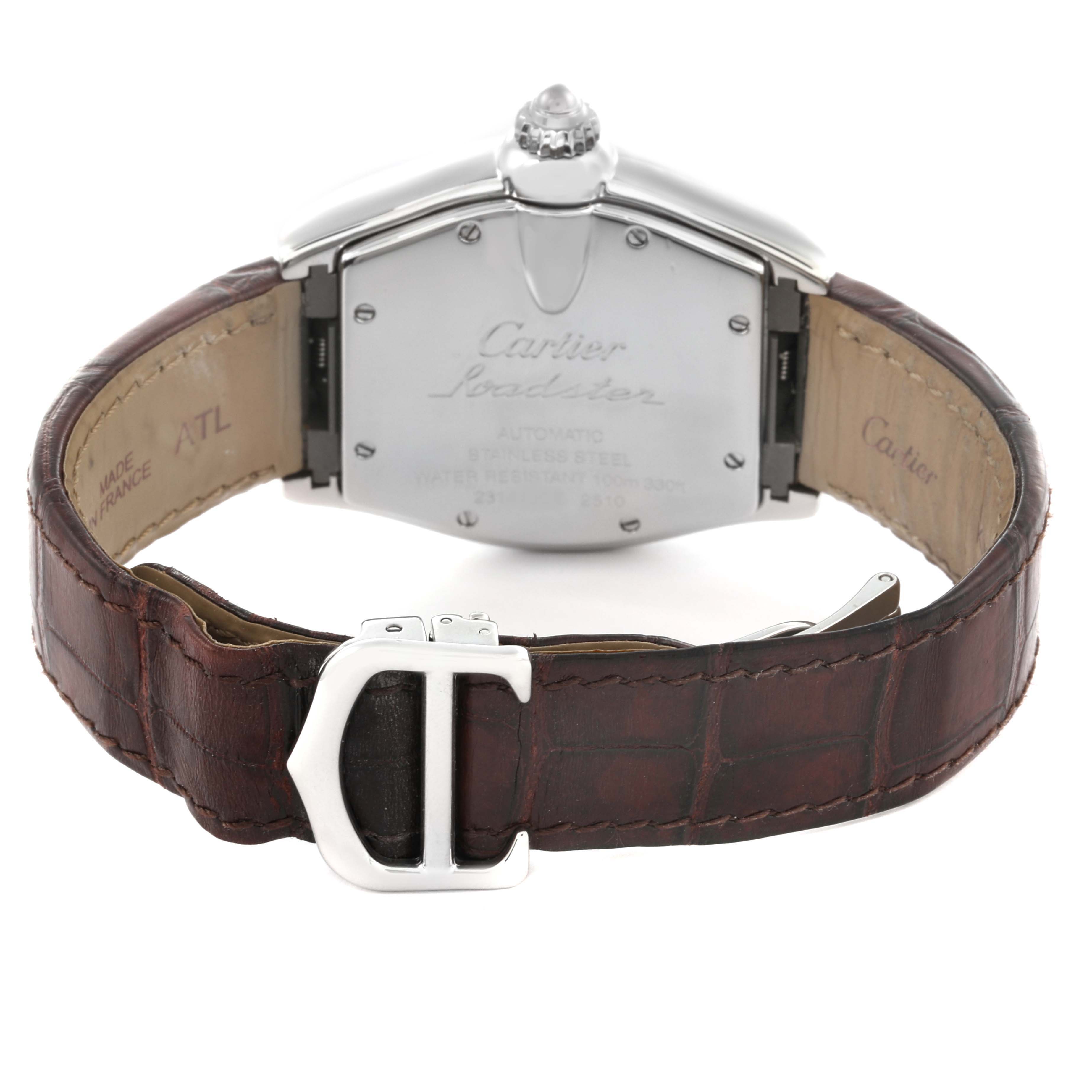 The Cartier Roadster W62025V3 Men's Stainless Steel Silver Dial W62025V3 Men's Stainless Steel Silver Dial watch is shown from the back, highlighting the case back and brown leather strap with a metal clasp.
