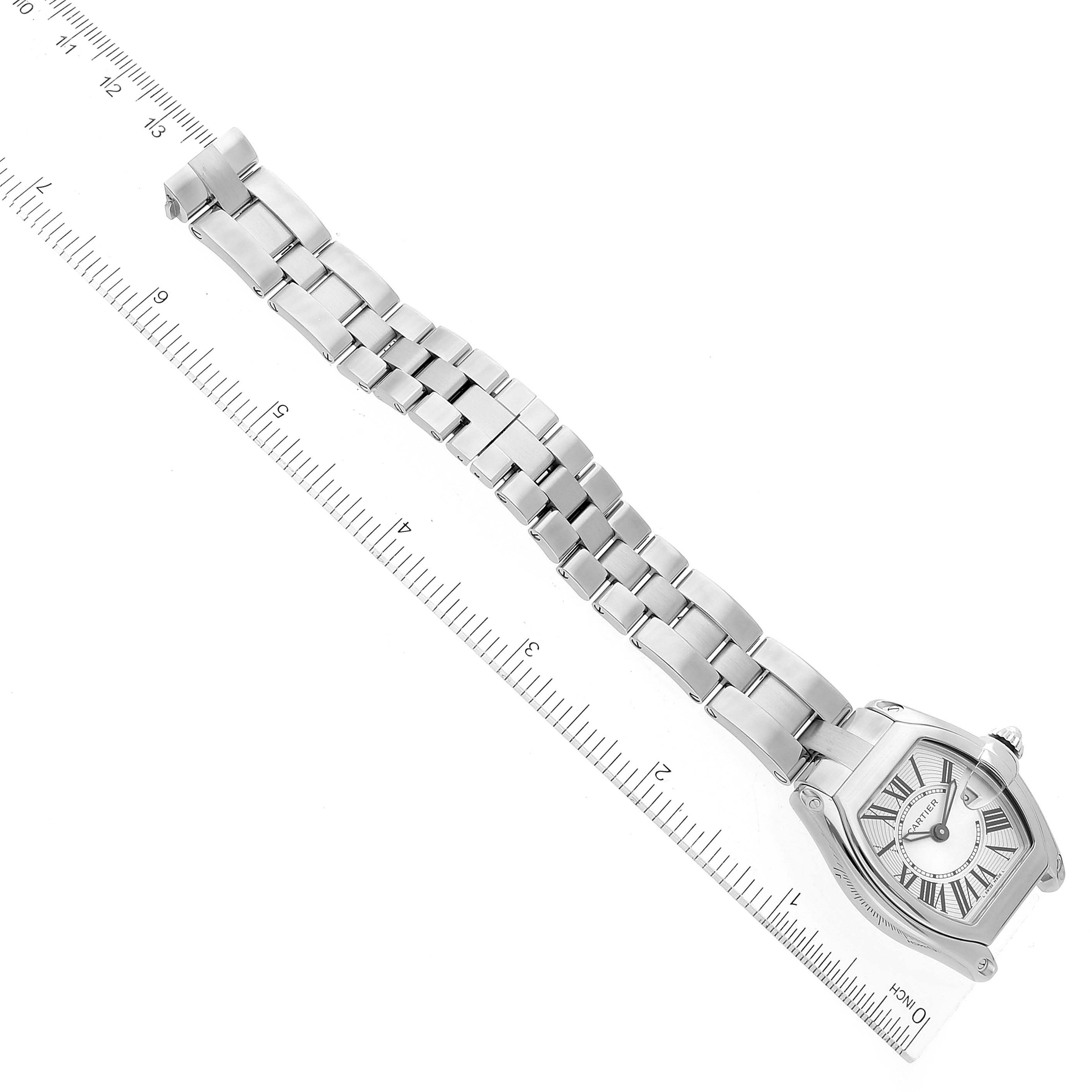The image shows a Cartier Roadster W62016V3 Women's Stainless Steel Silver Dial W62016V3 Women's Stainless Steel Silver Dial watch laid flat with its metal bracelet aligned along a measuring ruler.
