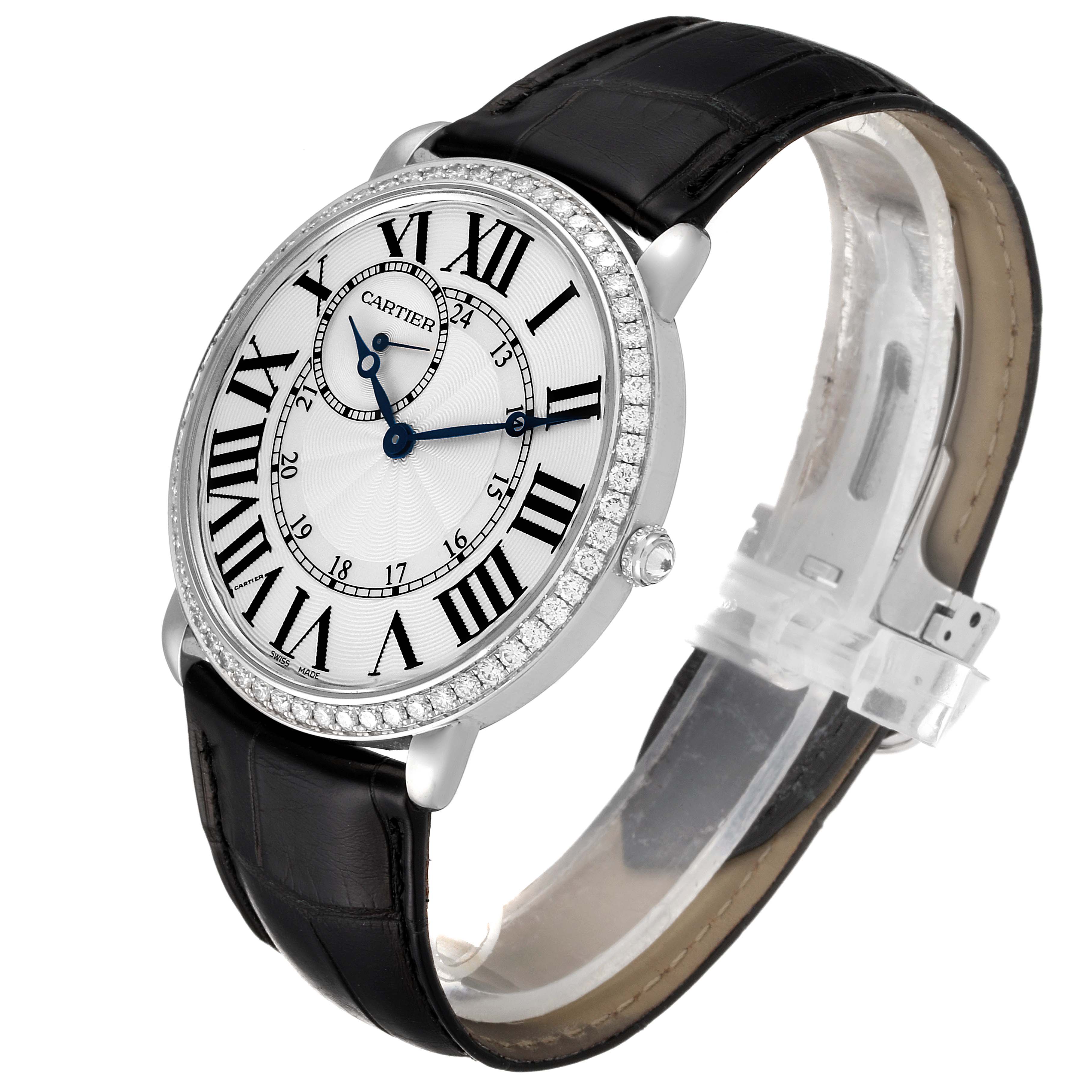 The image shows a Cartier Ronde WR007002 Men's White Gold Silver Dial WR007002 Men's White Gold Silver Dial watch at a slight angle, highlighting its black leather strap and diamond-encrusted bezel.