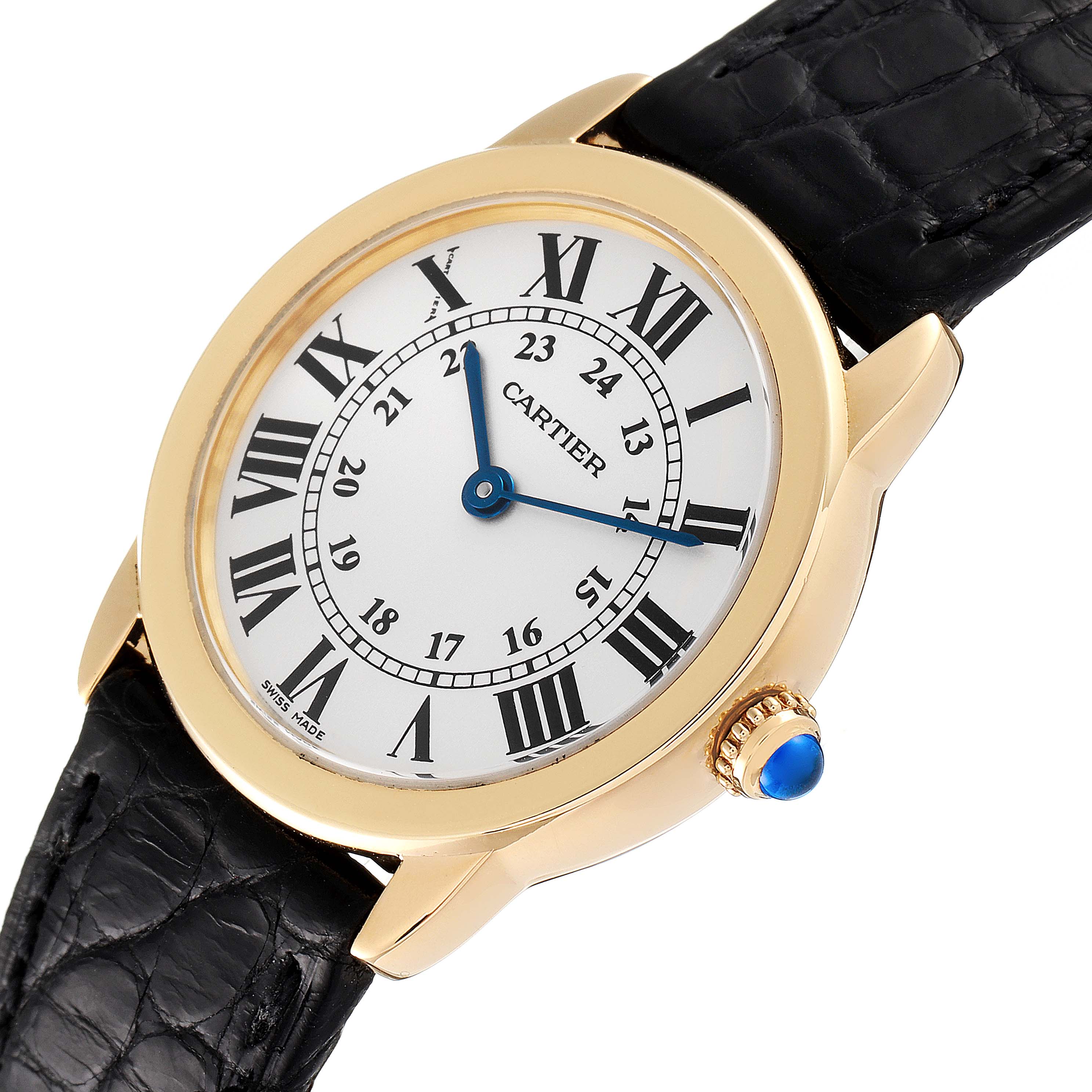 The Cartier Ronde W6700355 Women's Yellow Gold Silver Dial W6700355 Women's Yellow Gold Silver Dial watch is shown at a slight angle, displaying the face, bezel, crown, and part of the black leather strap.