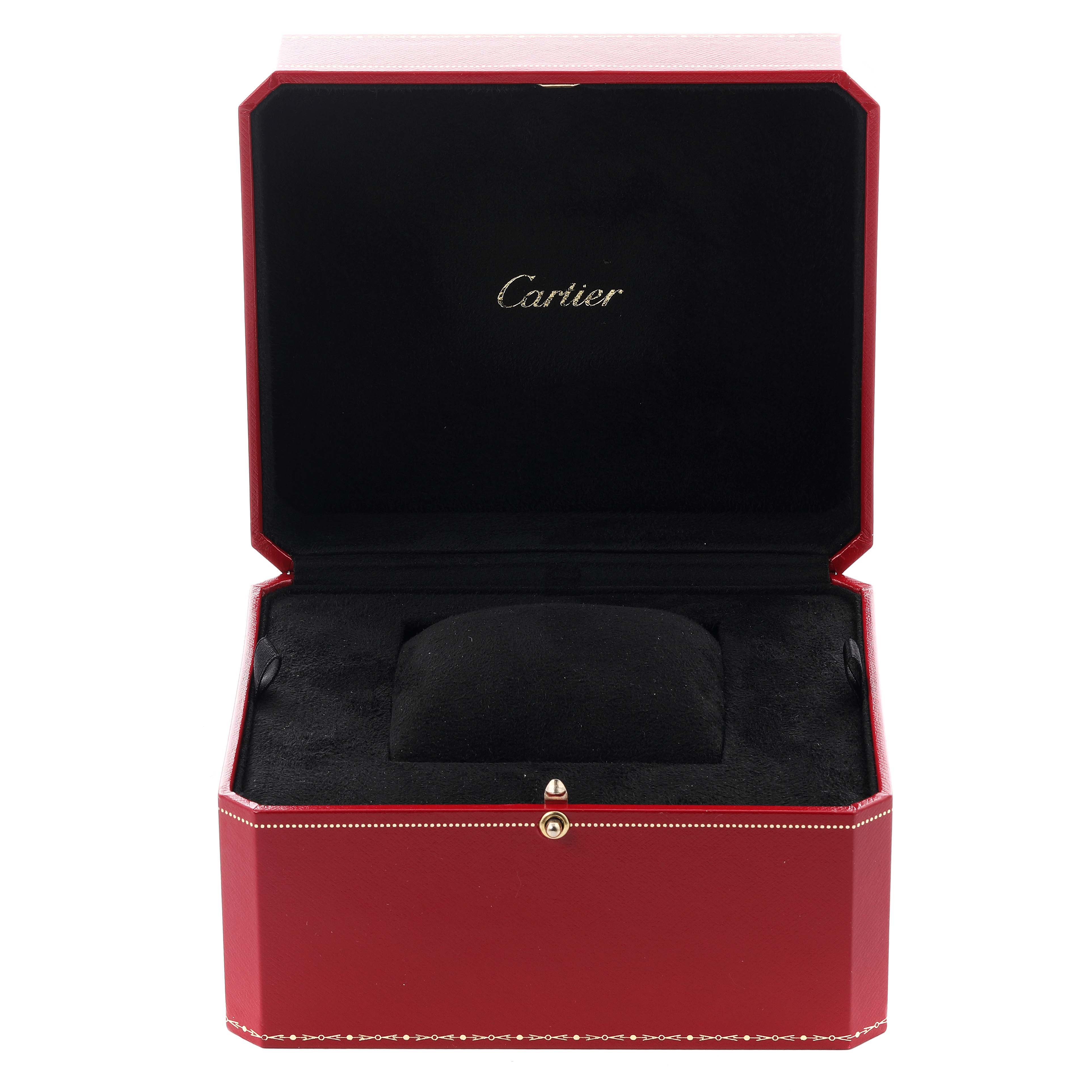 The image shows an open Cartier watch box for the Santos Dumont model, highlighting its red exterior and black interior.