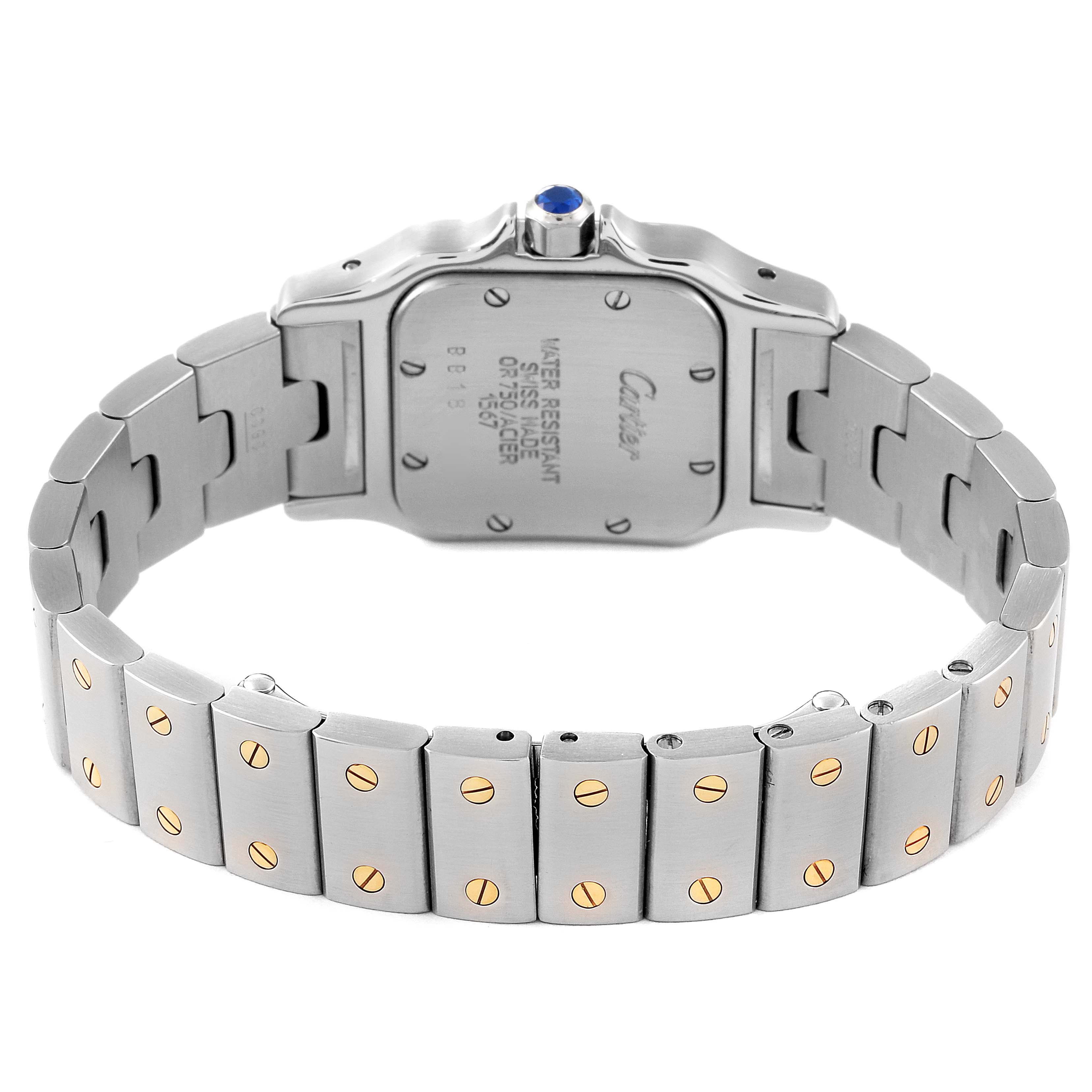 This image shows the back and bracelet of the Santos model by Cartier, highlighting its clasp, links, and caseback.