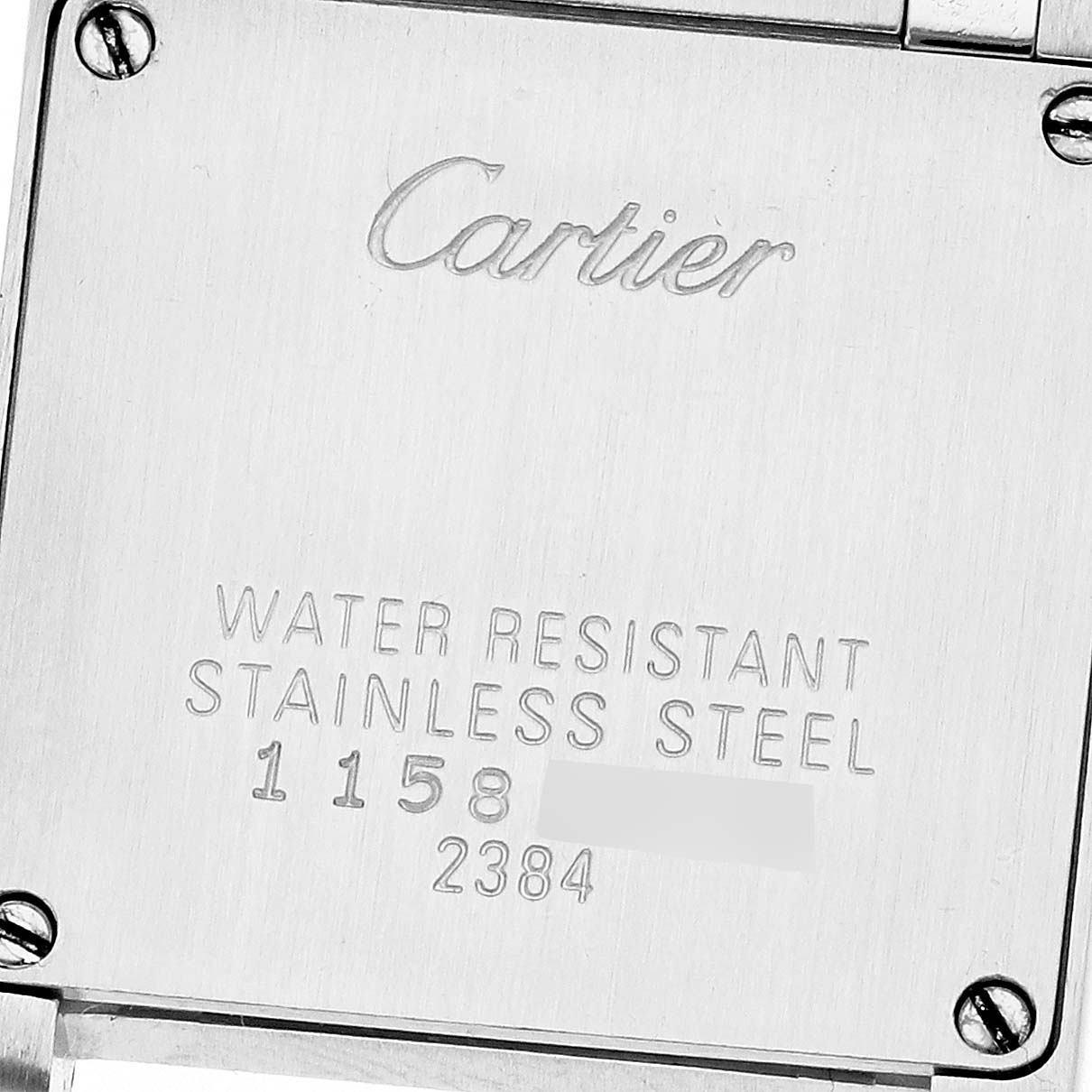The image shows the back of a Cartier Tank Française watch, highlighting engravings and screws.