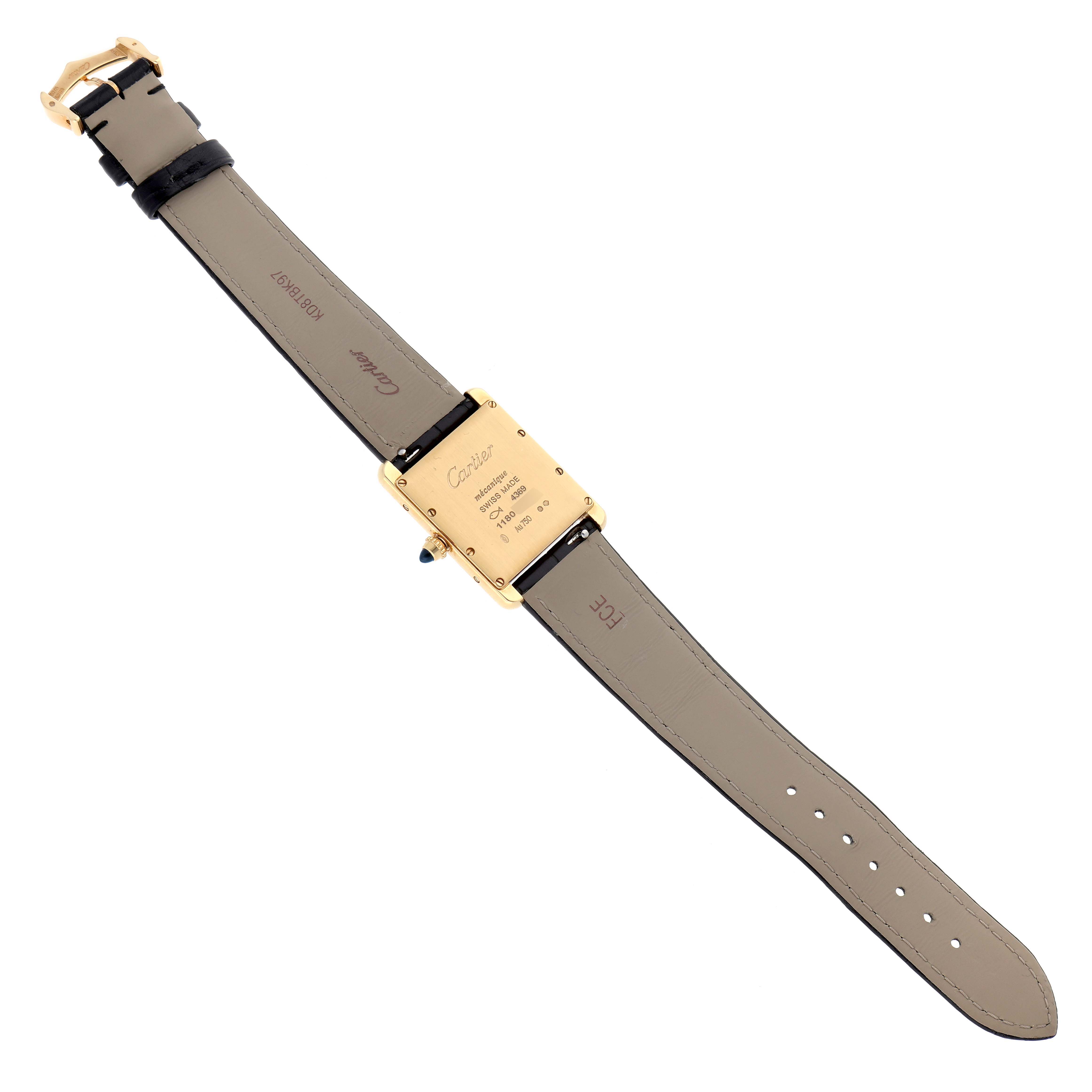 The image shows the back of the Cartier Tank Louis WGTA0091 Men's Yellow Gold Black Dial WGTA0091 Men's Yellow Gold Black Dial watch, featuring the strap, buckle, and the engraved case back.