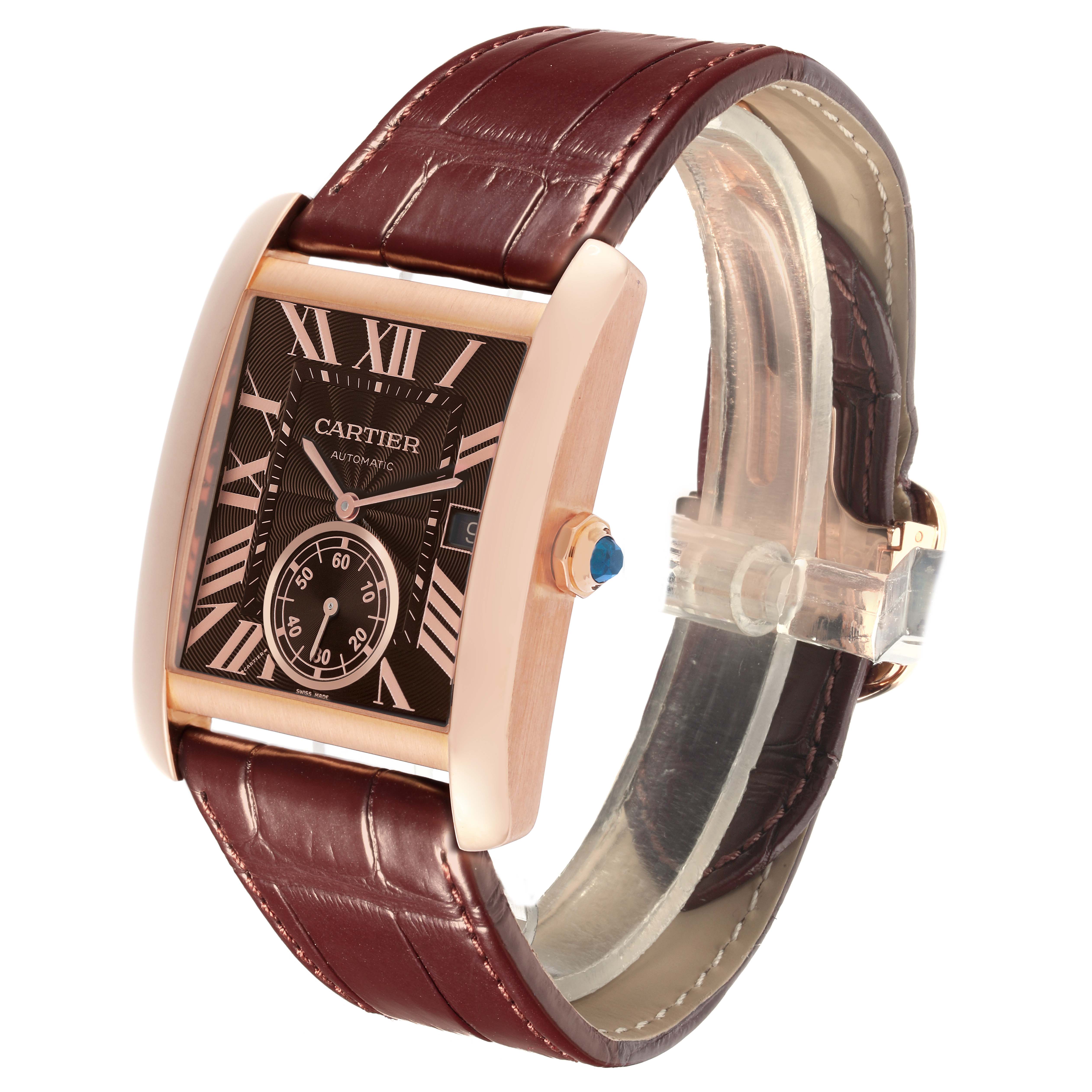 The Cartier Tank MC W5330002 Men's Rose Gold Brown Dial W5330002 Men's Rose Gold Brown Dial watch is shown at an angled view, highlighting its face, strap, and crown with a visible blue stone.