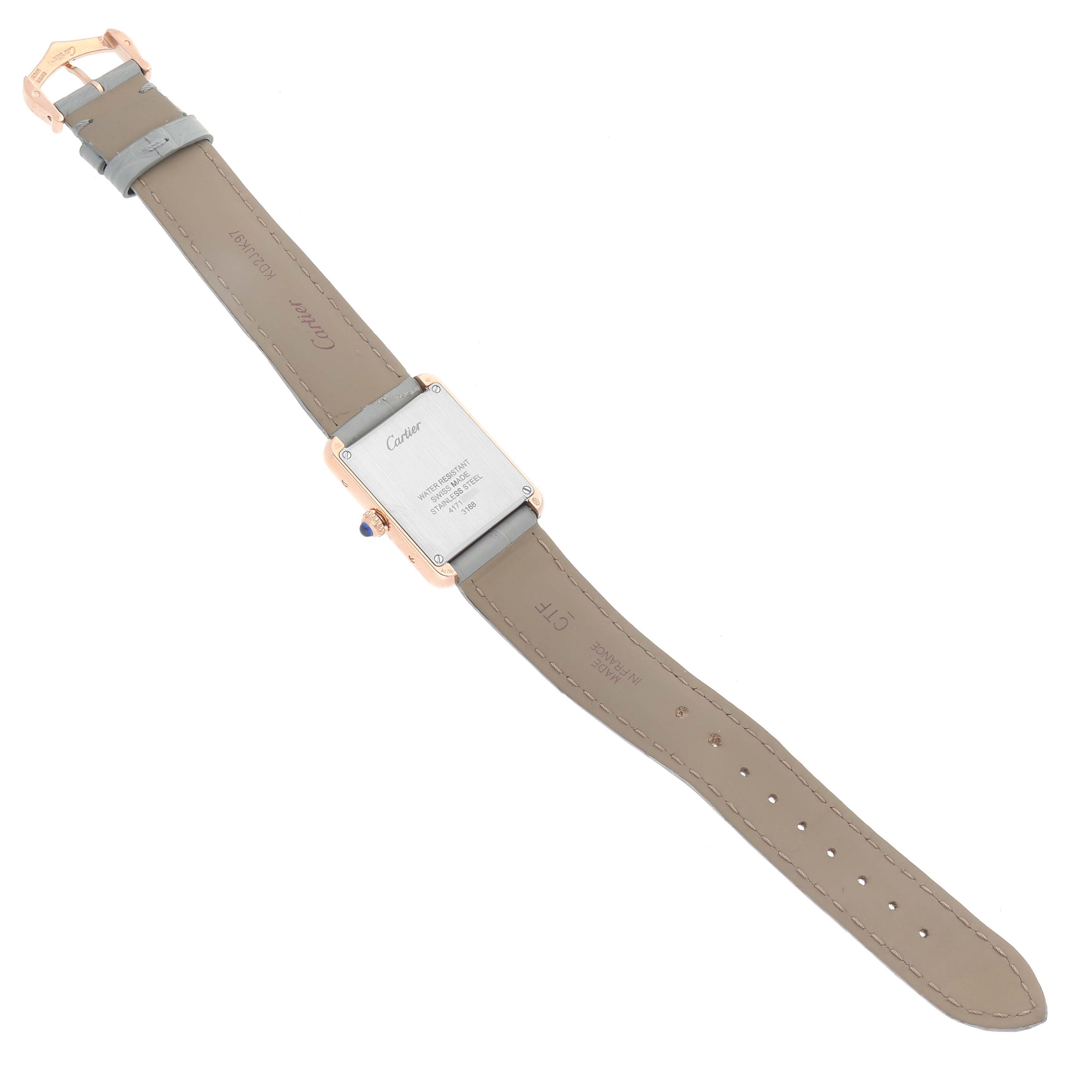 The Cartier Tank Solo W5200024 Women's Steel and Gold (two tone) Silver Dial W5200024 Women's Steel and Gold (two tone) Silver Dial watch is shown from behind, highlighting the case back and beige leather strap.