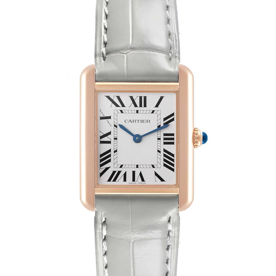 The Cartier Tank Solo watch is shown from the front, featuring its rectangular case, Roman numerals, blue hands, and leather strap.