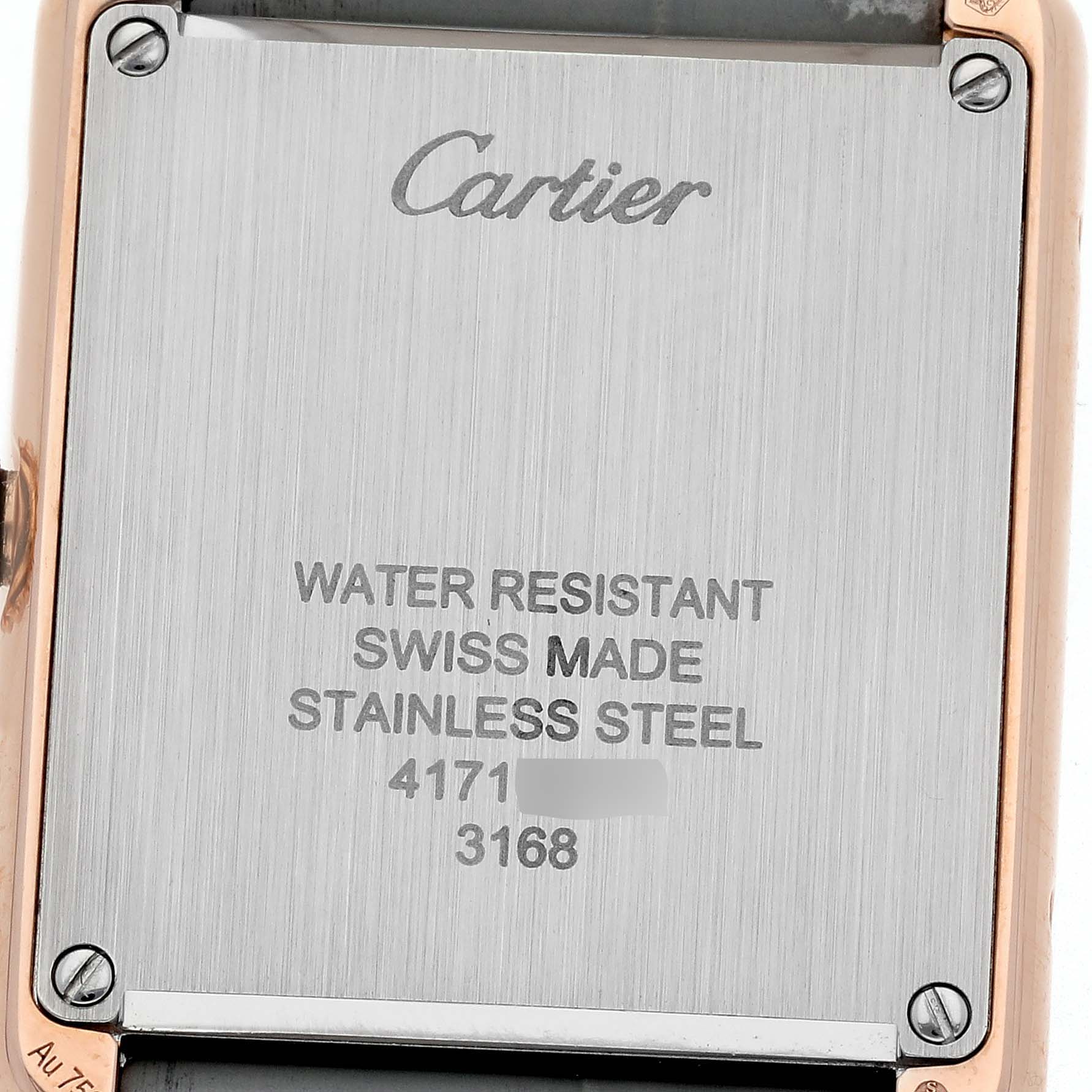 The image shows the back case of a Cartier Tank Solo W5200024 Women's Steel and Gold (two tone) Silver Dial W5200024 Women's Steel and Gold (two tone) Silver Dial watch, highlighting its stainless steel construction and inscriptions.