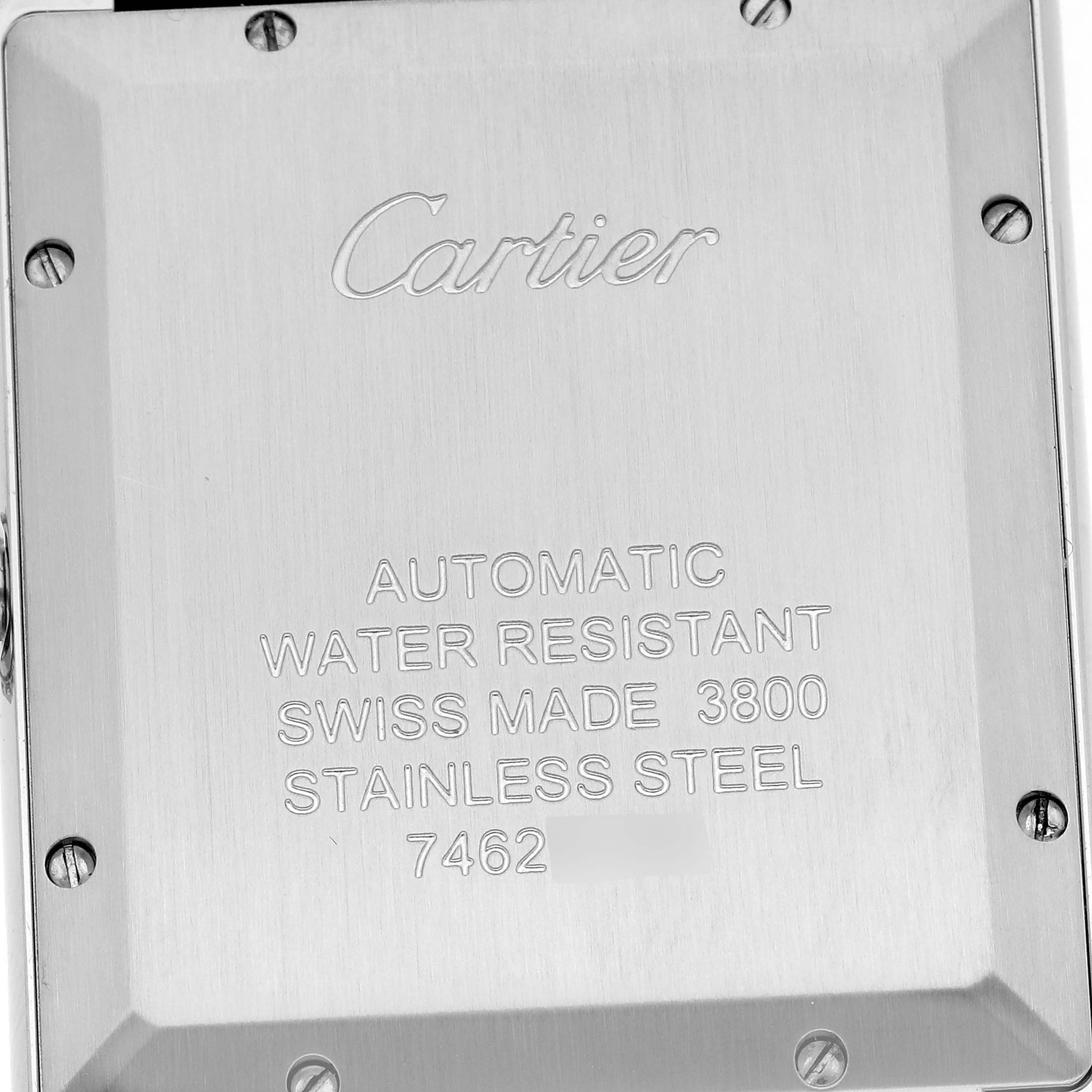 The image shows the back casing of the Cartier Tank Solo WSTA0029 Men's Stainless Steel Silver Dial WSTA0029 Men's Stainless Steel Silver Dial watch, highlighting its engraved details and screws.