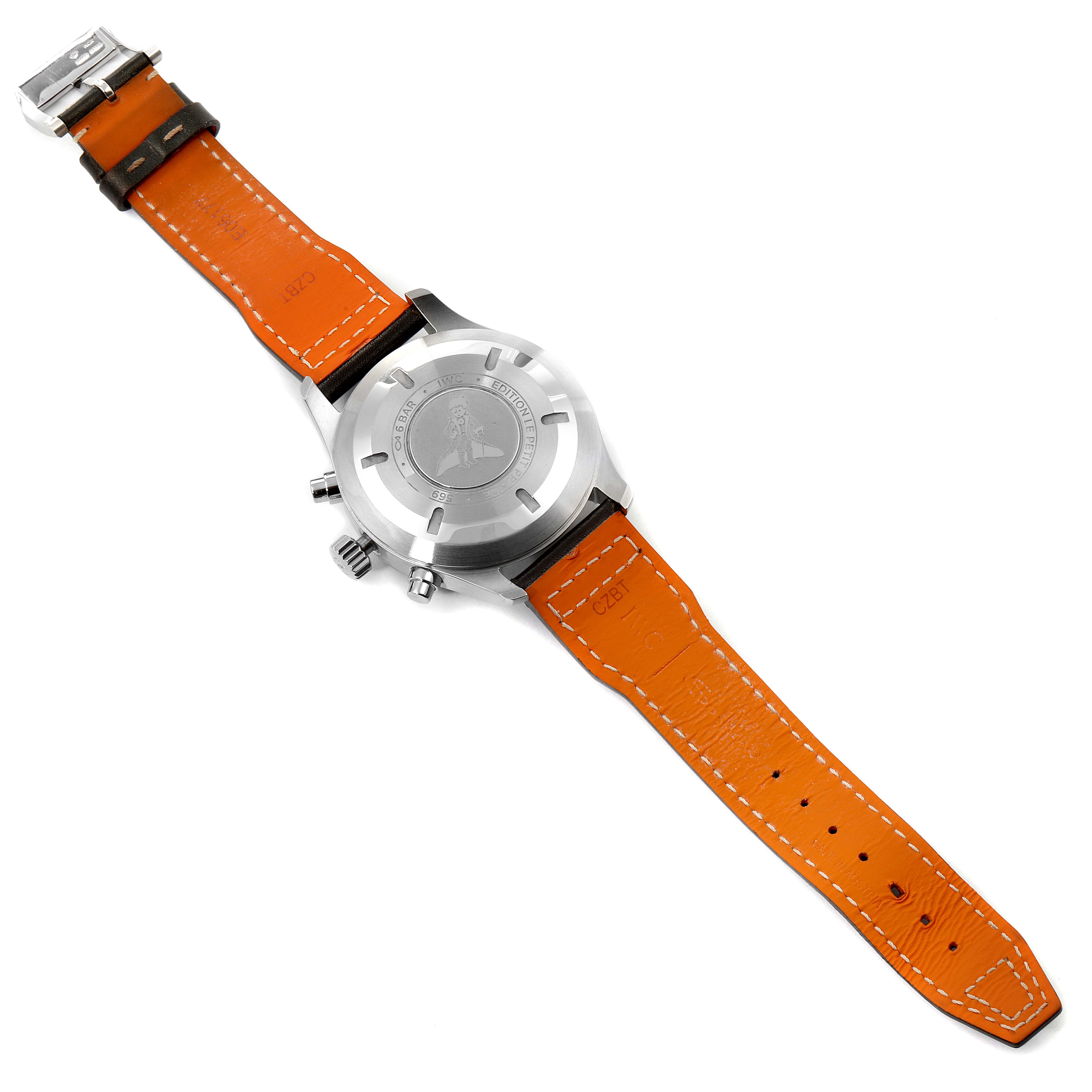 This image shows the back view of an IWC Pilot IW377714 Men's Stainless Steel Blue Dial IW377714 Men's Stainless Steel Blue Dial model watch, featuring an orange leather strap and visible lugs and crown.