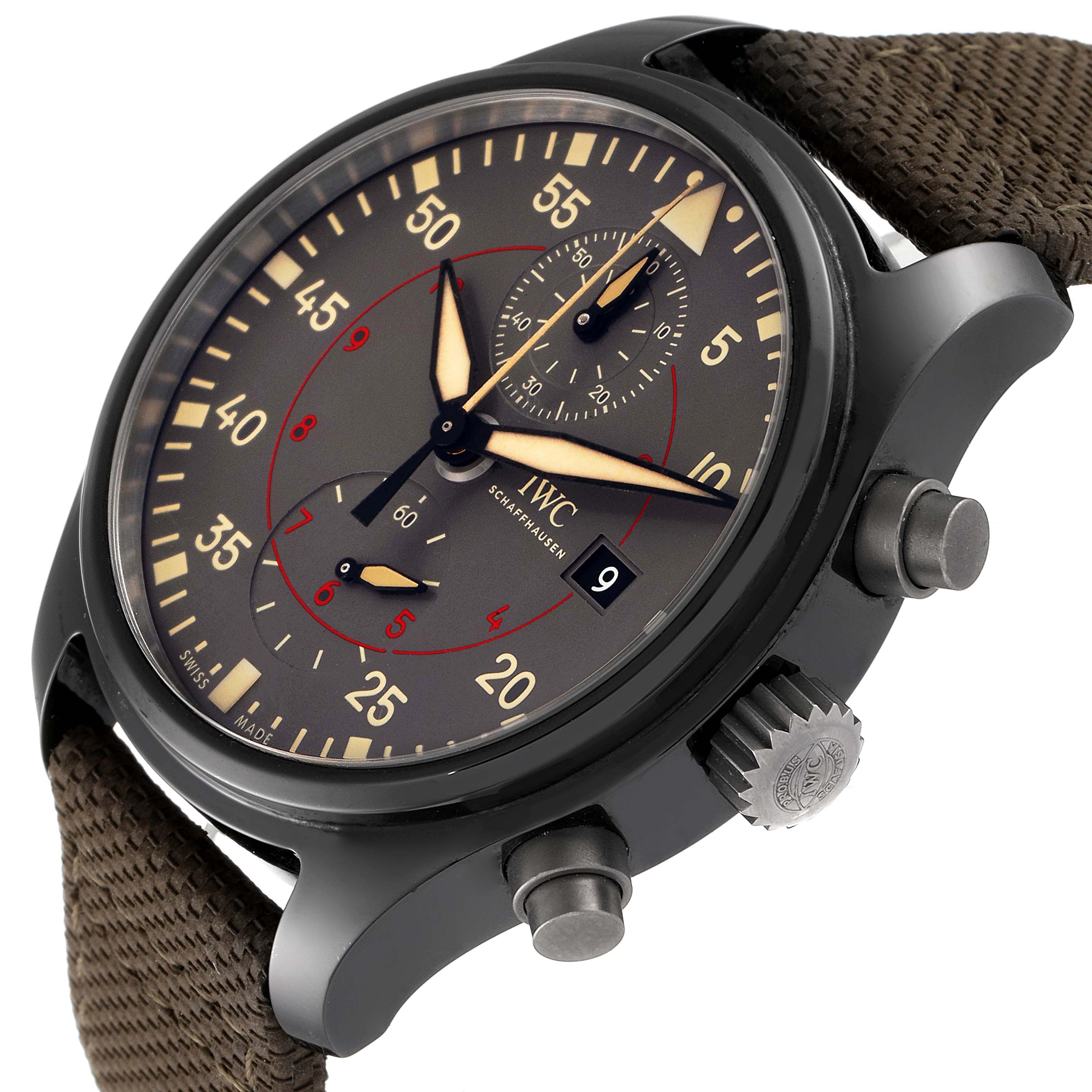 The IWC Pilot IW389002 Men's Ceramic Black Dial IW389002 Men's Ceramic Black Dial model watch is shown from a three-quarter angle, displaying its face, crown, push buttons, and strap.