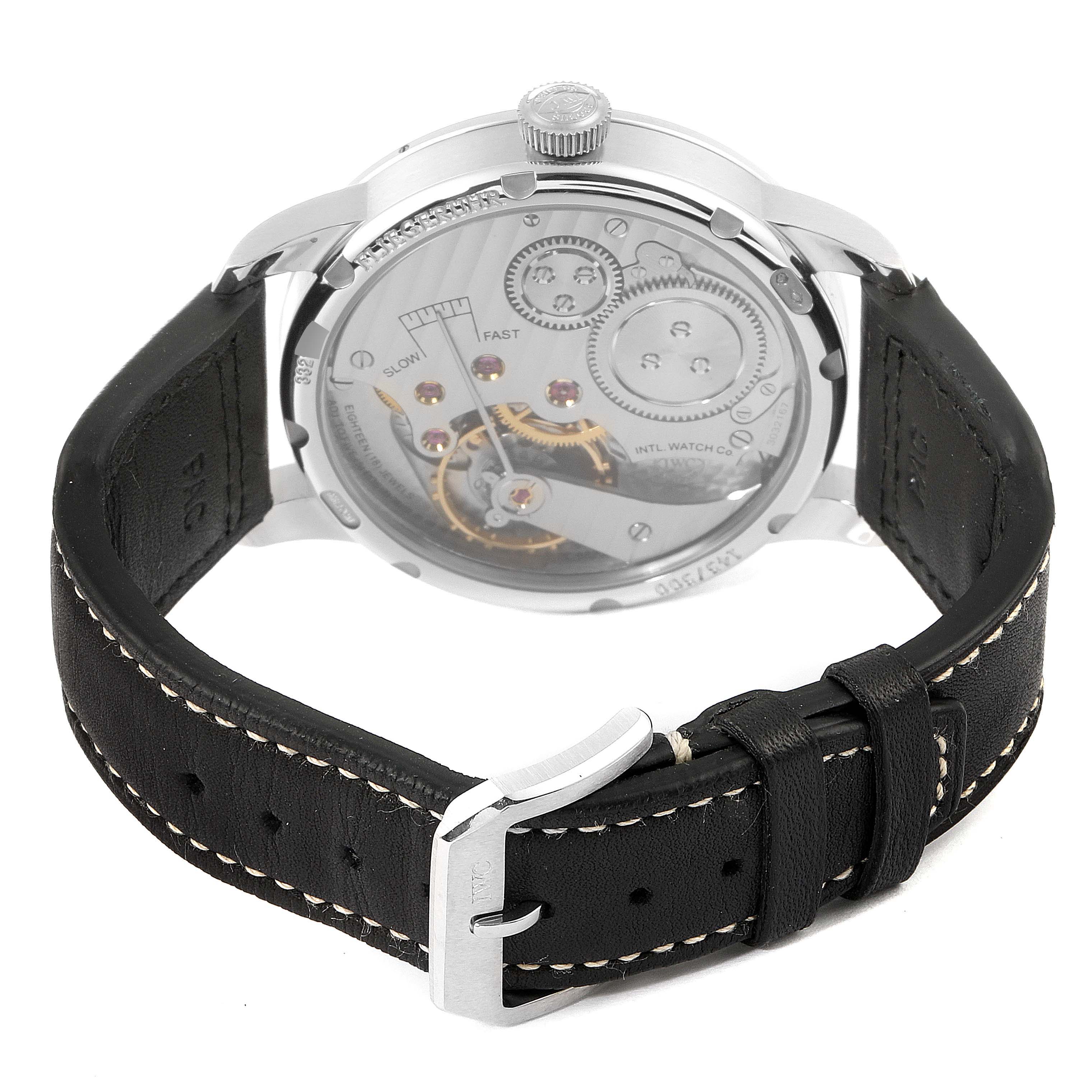 This image shows the back view of the IWC Pilot IW325405 Men's Titanium Silver Dial IW325405 Men's Titanium Silver Dial model watch, featuring its mechanical movement and a black leather strap.