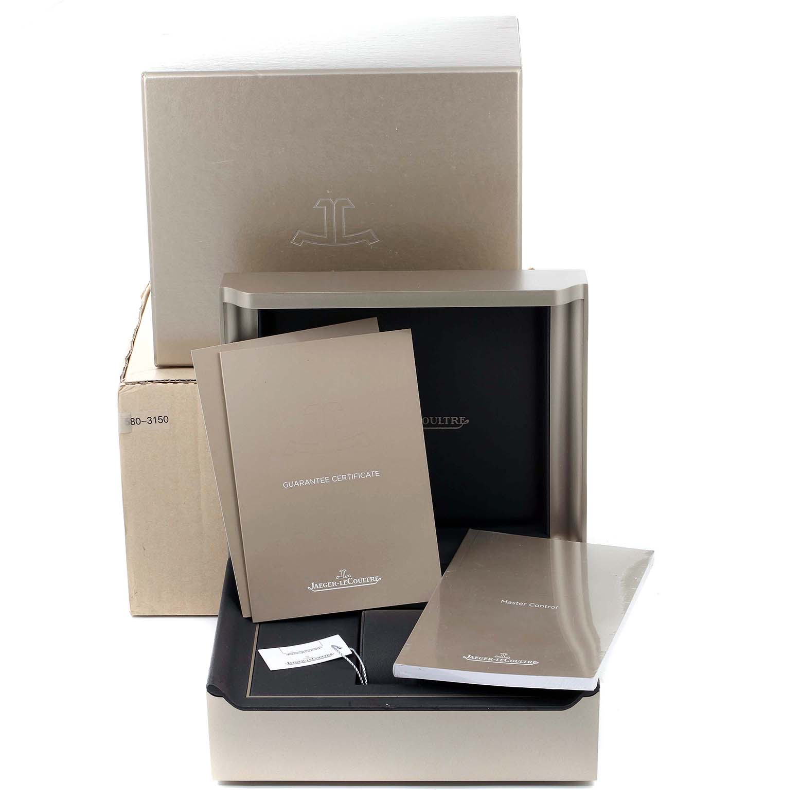 The image shows accessories for the Jaeger-LeCoultre Master model, including the box, guarantee certificate, and manuals.
