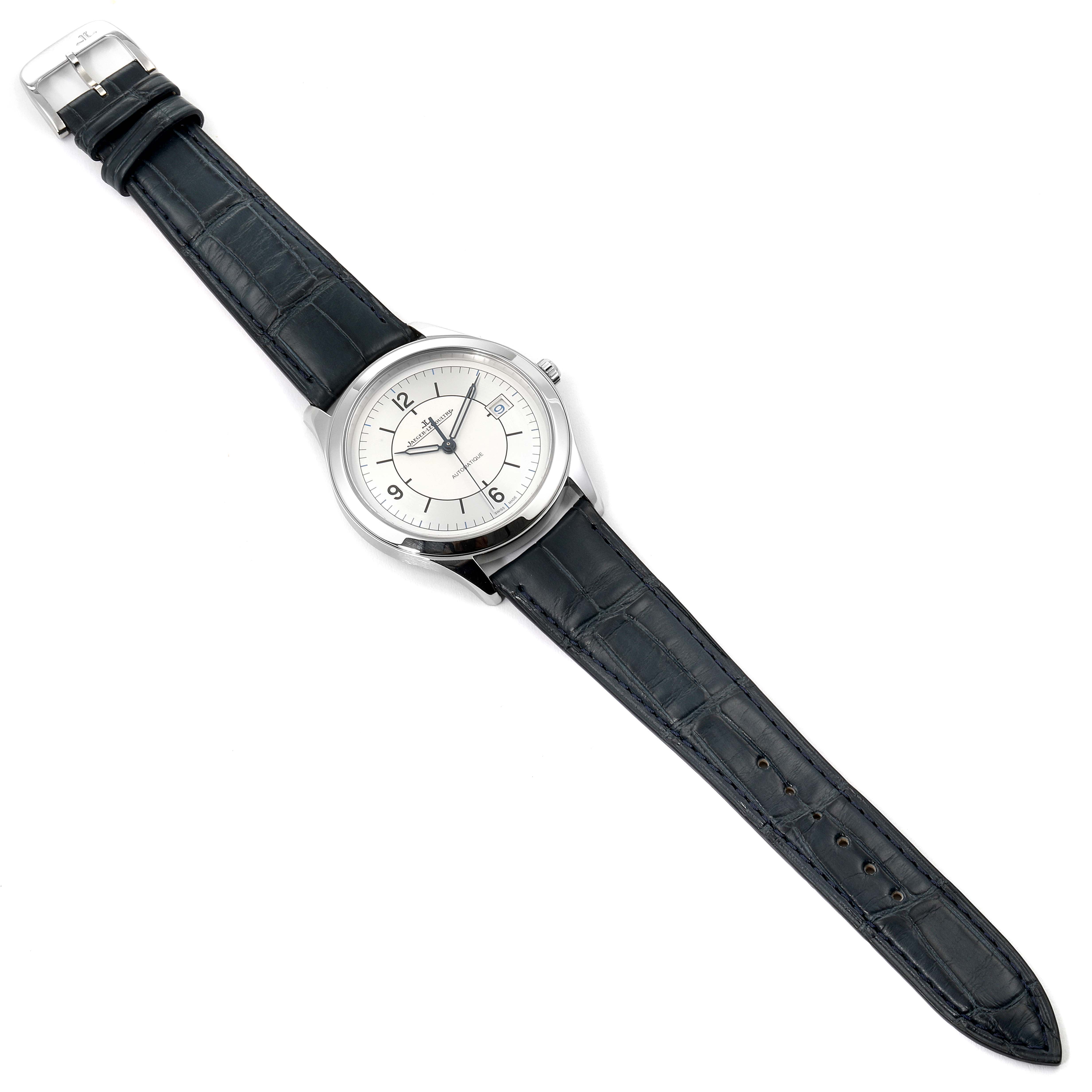 The Jaeger-LeCoultre Master model watch is shown from a top-down angle, featuring its face, case, and leather strap.