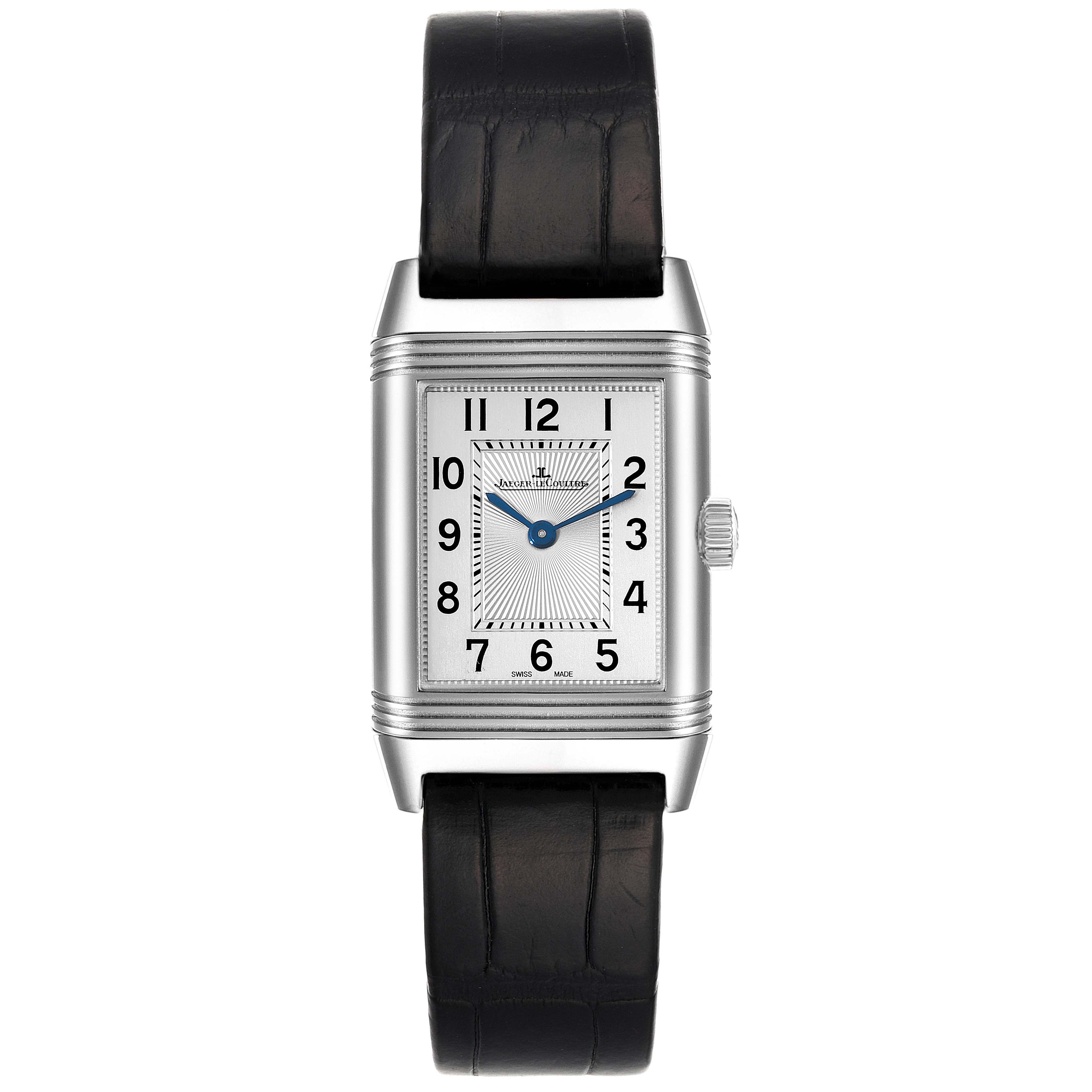 The image shows a front view of a Jaeger LeCoultre Reverso Q2668430 Women's Stainless Steel Silver Dial Q2668430 Women's Stainless Steel Silver Dial watch, featuring a rectangular dial, blue hands, and a black leather strap.