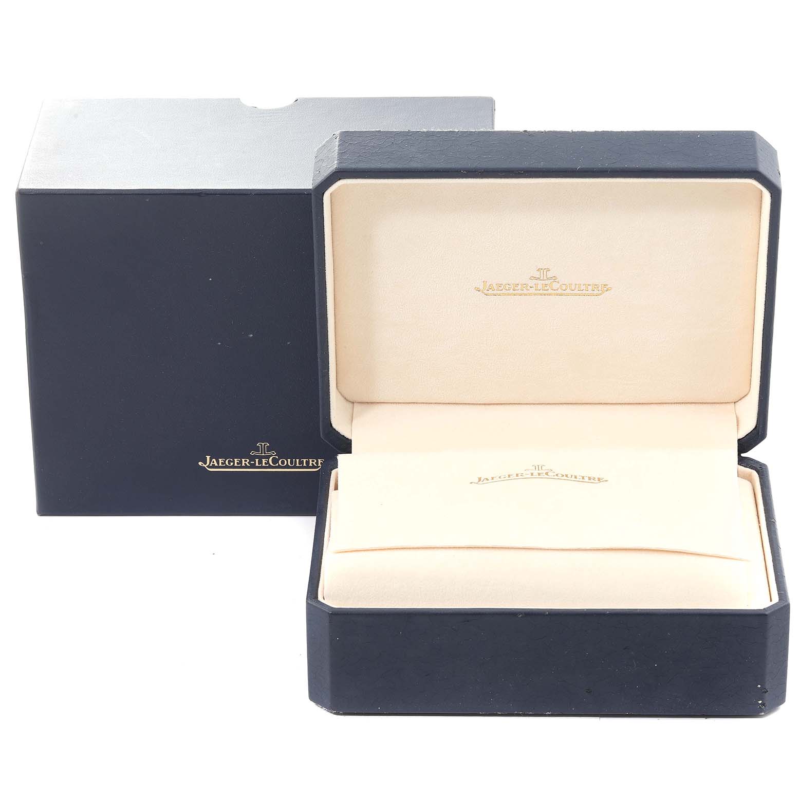 The image shows an open Reverso watch box by Jaeger-LeCoultre with the lid and inner compartments visible.