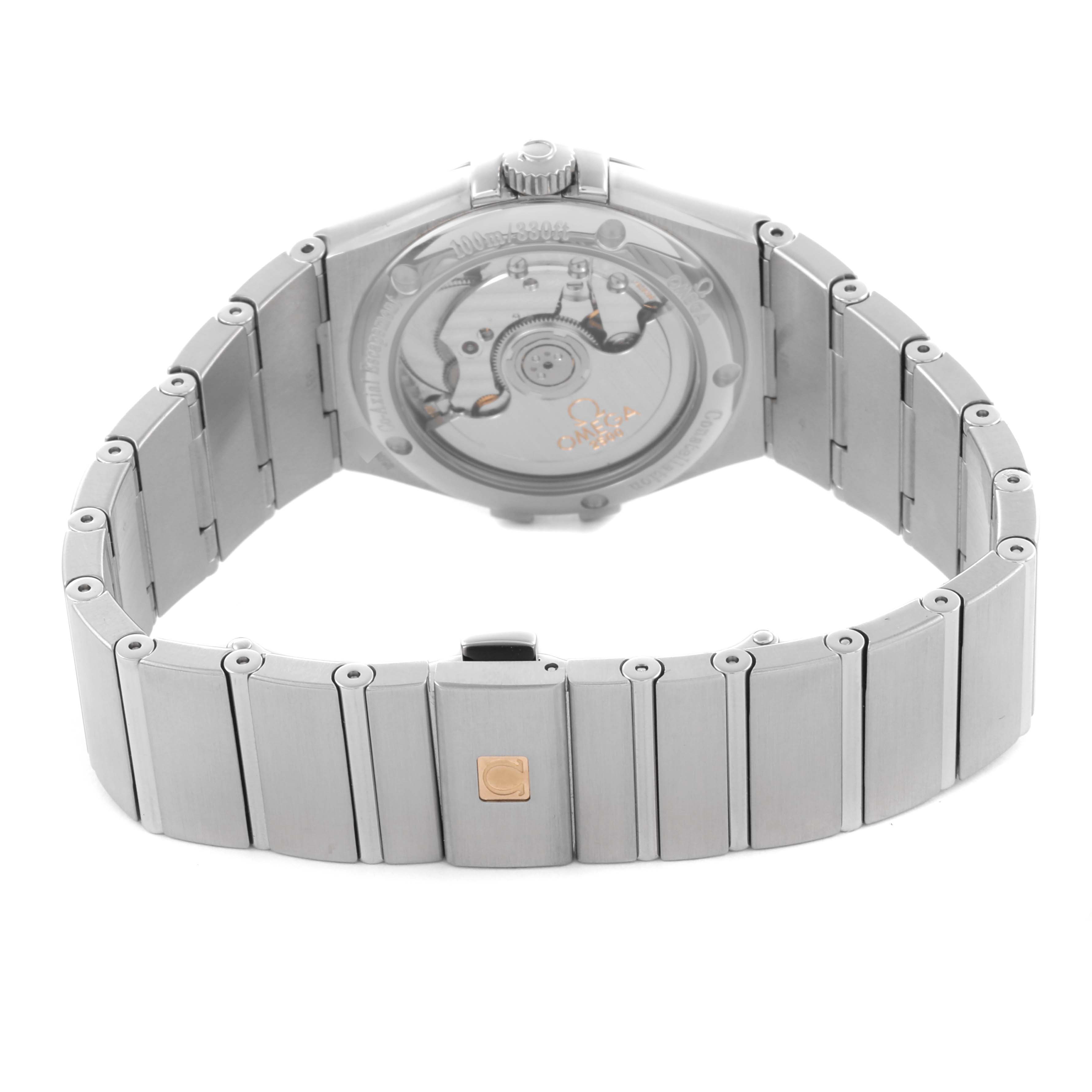 The image shows the back view of an Omega Constellation 123.10.35.20.01.001 Men's Stainless Steel Black Dial 123.10.35.20.01.001 Men's Stainless Steel Black Dial watch, highlighting the movement and bracelet.