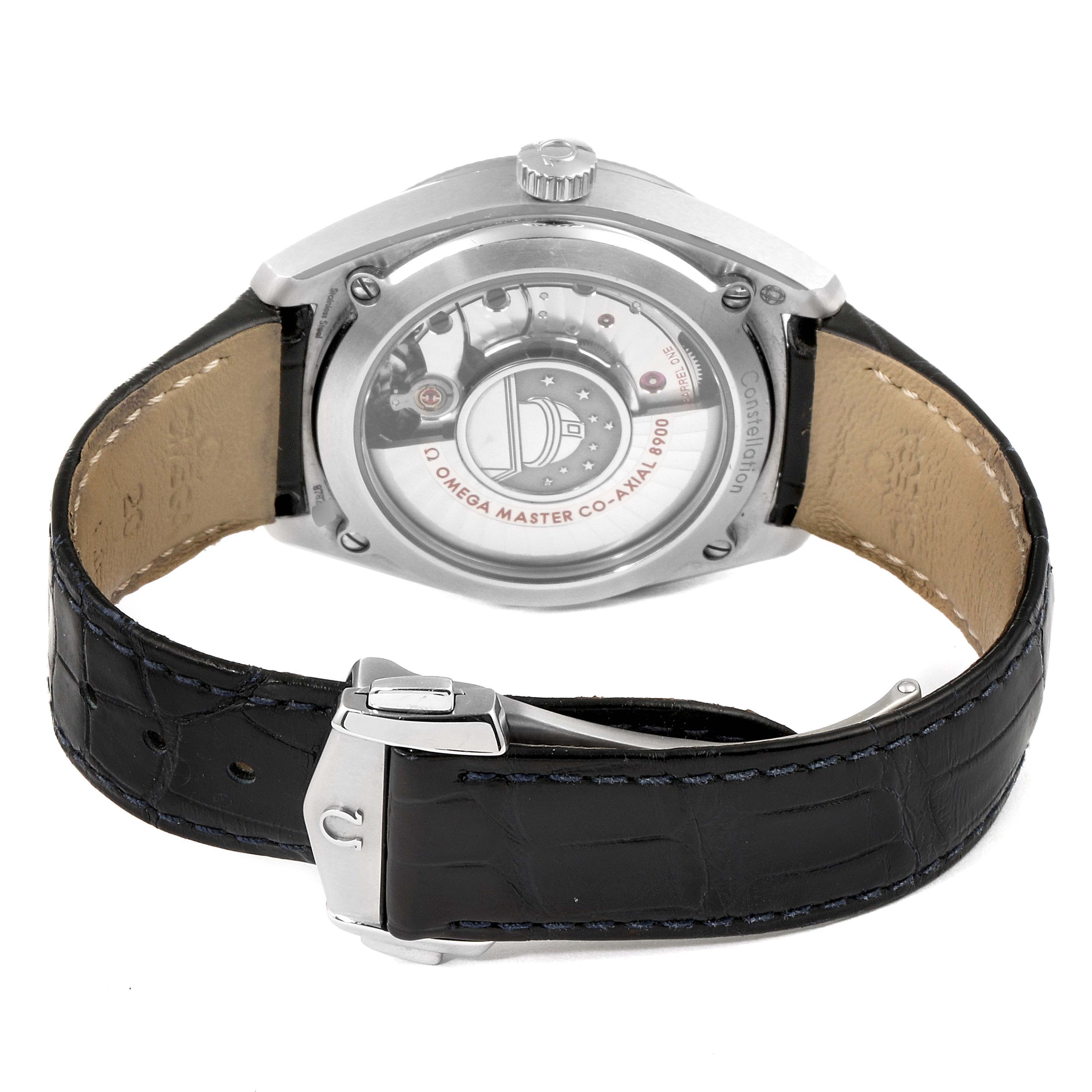The image shows the back view of an Omega Constellation 130.33.39.21.03.001 Men's Stainless Steel Blue Dial 130.33.39.21.03.001 Men's Stainless Steel Blue Dial watch, displaying the movement and black leather strap with a clasp.