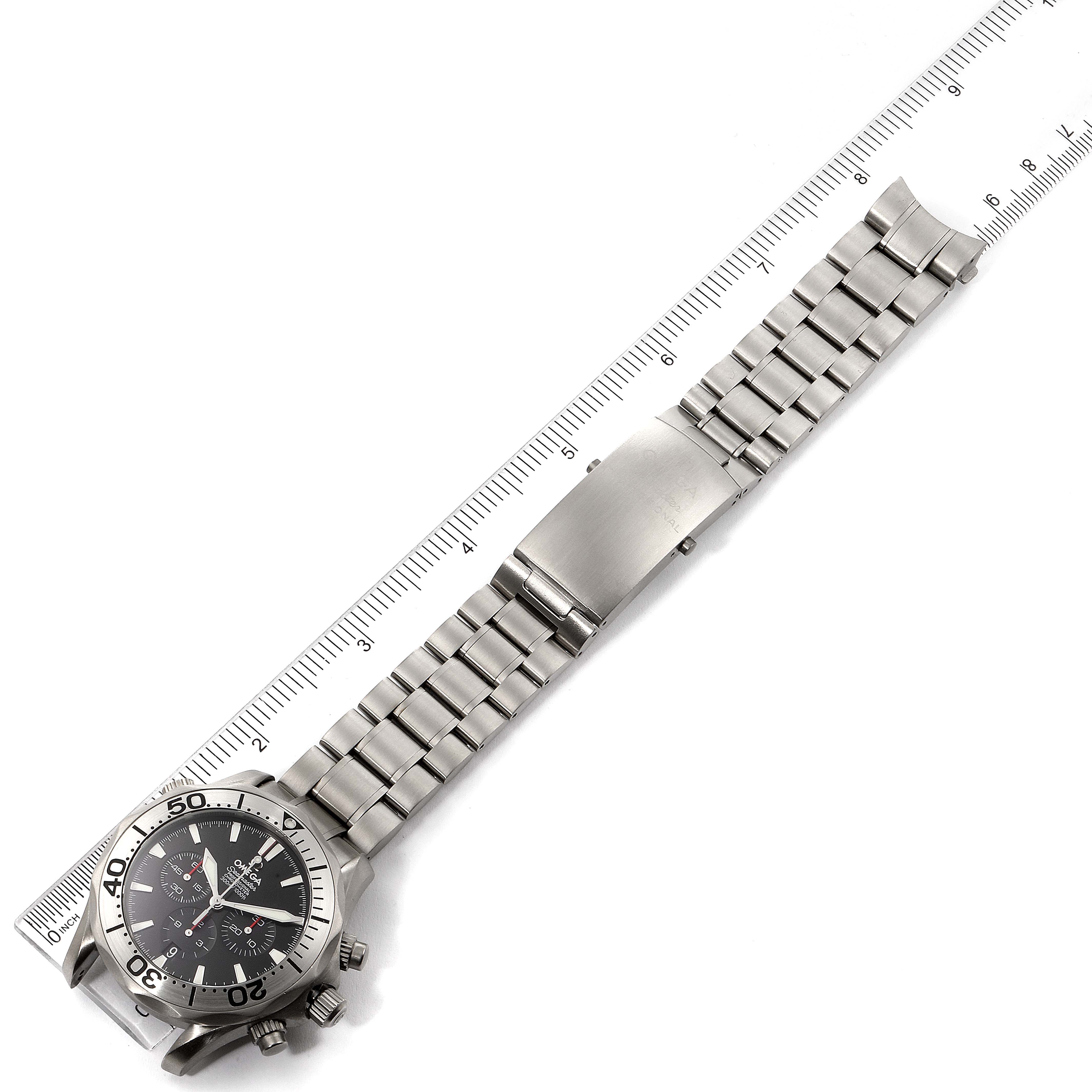The image shows an Omega Seamaster 2293.52.00 Men's Titanium Black Dial 2293.52.00 Men's Titanium Black Dial watch laid flat, showcasing its face, bracelet, and clasp, measured with a ruler.