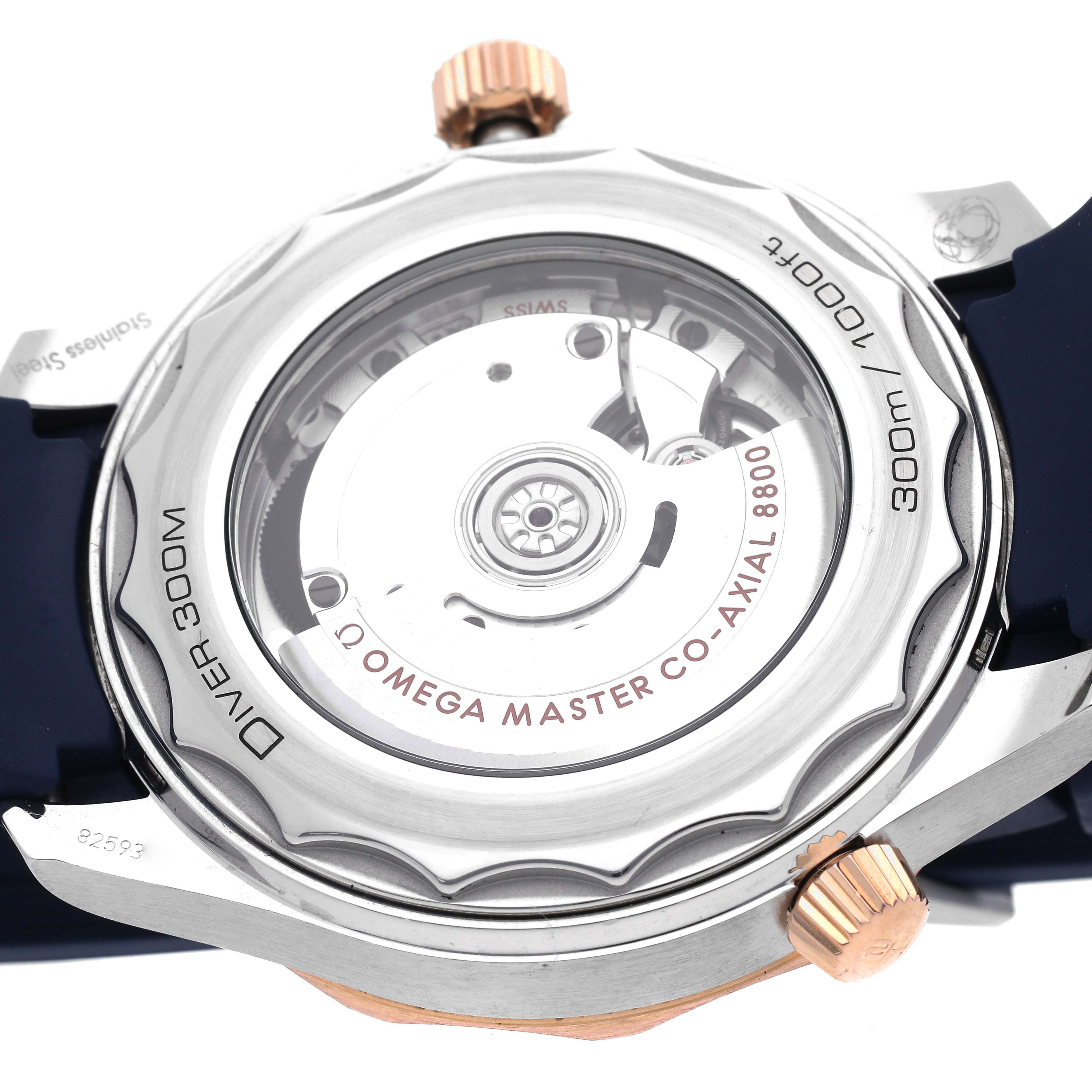 The image shows the case back of the Omega Seamaster 210.22.42.20.03.002 Men's Steel and Gold (two tone) Blue Dial 210.22.42.20.03.002 Men's Steel and Gold (two tone) Blue Dial watch, highlighting its Co-Axial 8800 movement.