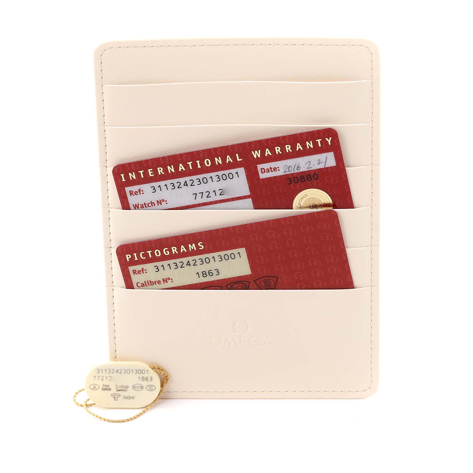 The image shows an Omega Speedmaster 311.30.42.30.13.001 Men's Stainless Steel Brown Dial 311.30.42.30.13.001 Men's Stainless Steel Brown Dial card holder with warranty and pictogram cards, along with a tag, from a top-down angle.