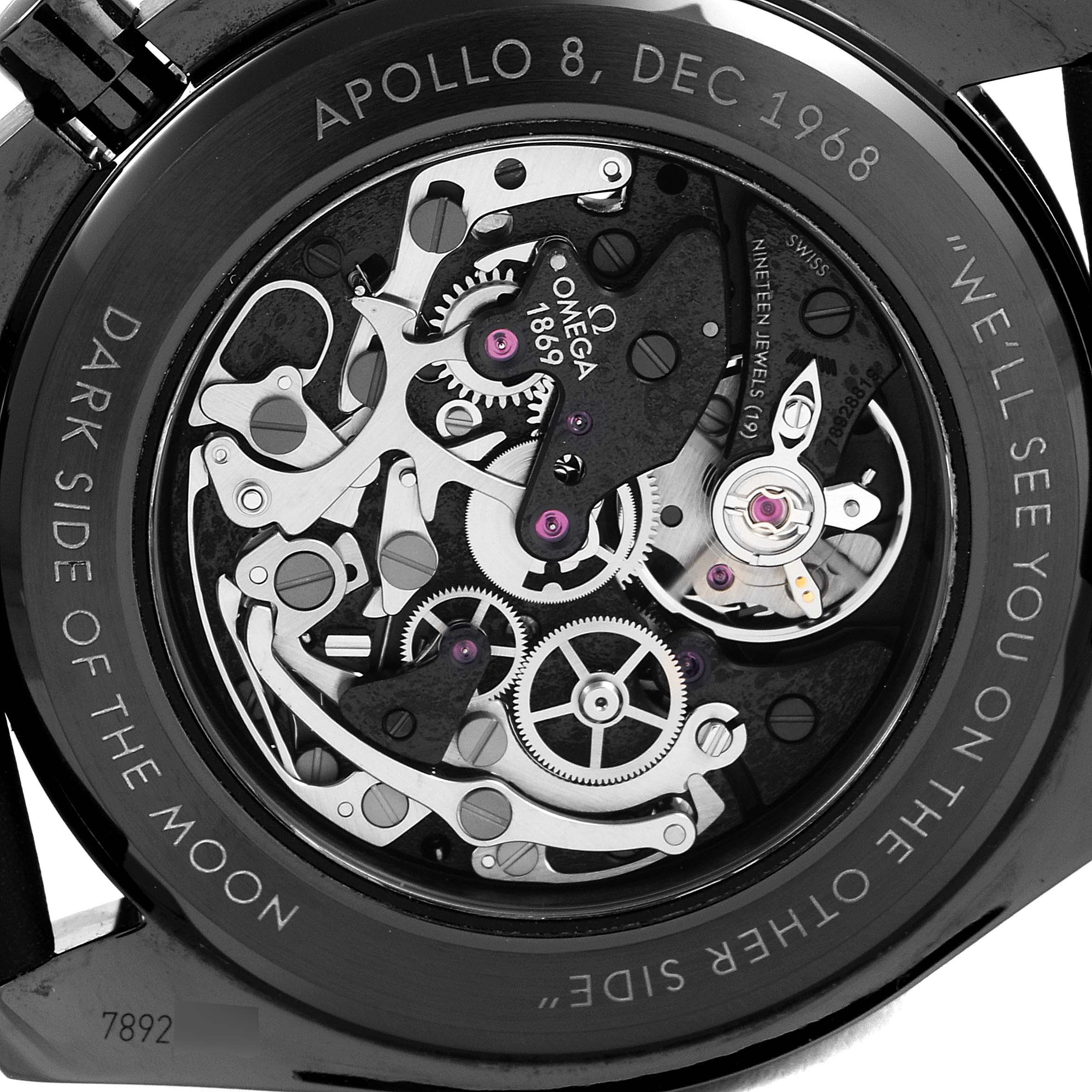 This image shows the inner mechanical components and engraved case back of an Omega Speedmaster 311.92.44.30.01.001 Men's Ceramic Black Dial 311.92.44.30.01.001 Men's Ceramic Black Dial "Dark Side of the Moon" watch.