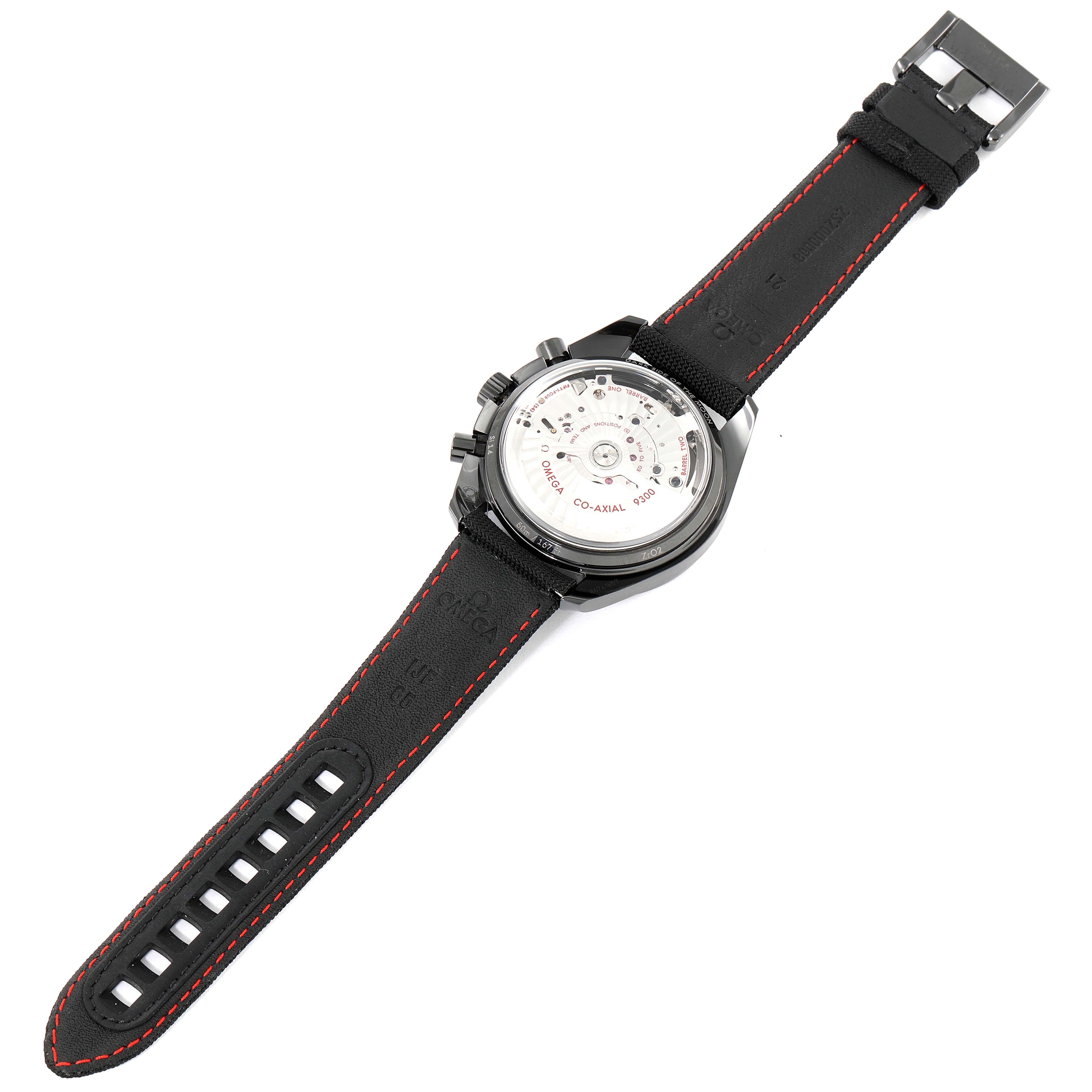 This image shows the back view of the Omega Speedmaster 311.92.44.51.01.003 Men
s Stainless Steel Black Dial 311.92.44.51.01.003 Men
s Stainless Steel Black Dial, highlighting its co-axial movement and strap with red stitching.