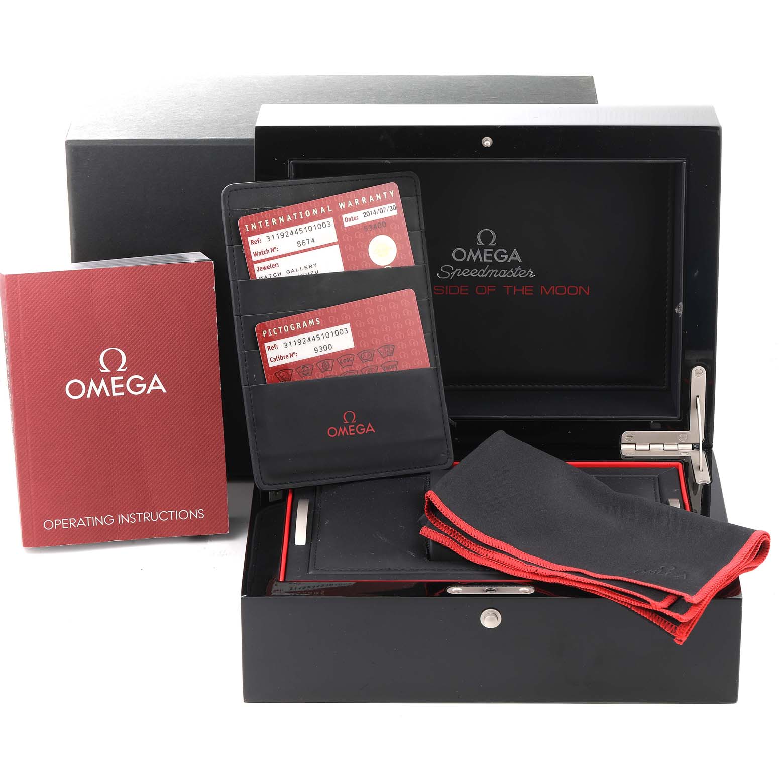The image shows Omega Speedmaster 311.92.44.51.01.003 Men
s Stainless Steel Black Dial 311.92.44.51.01.003 Men
s Stainless Steel Black Dial accessories, including the box, instruction manual, warranty cards, and a cleaning cloth.