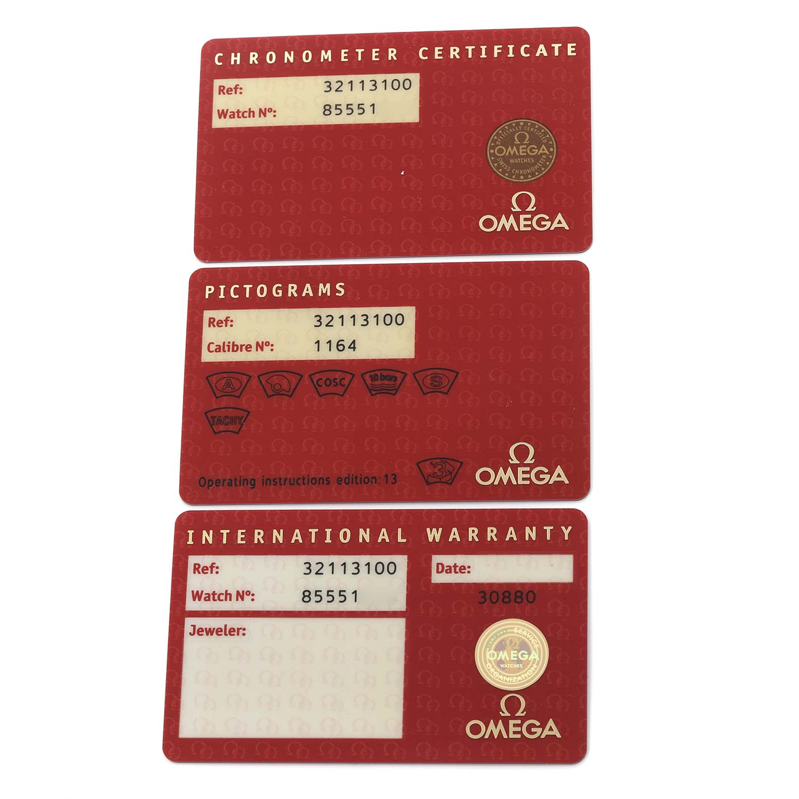 The image shows three Omega Speedmaster 3211.31.00 Men
s Stainless Steel Silver Dial 3211.31.00 Men
s Stainless Steel Silver Dial accessory cards: Chronometer Certificate, Pictograms, and International Warranty.