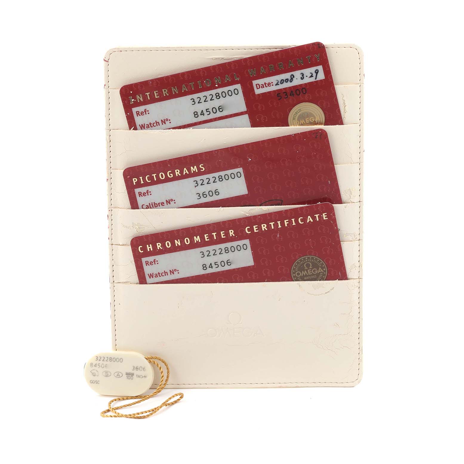 The image shows warranty and certification cards for an Omega Speedmaster 3222.80.00 Men
s Stainless Steel Blue Dial 3222.80.00 Men
s Stainless Steel Blue Dial, along with an informational tag.