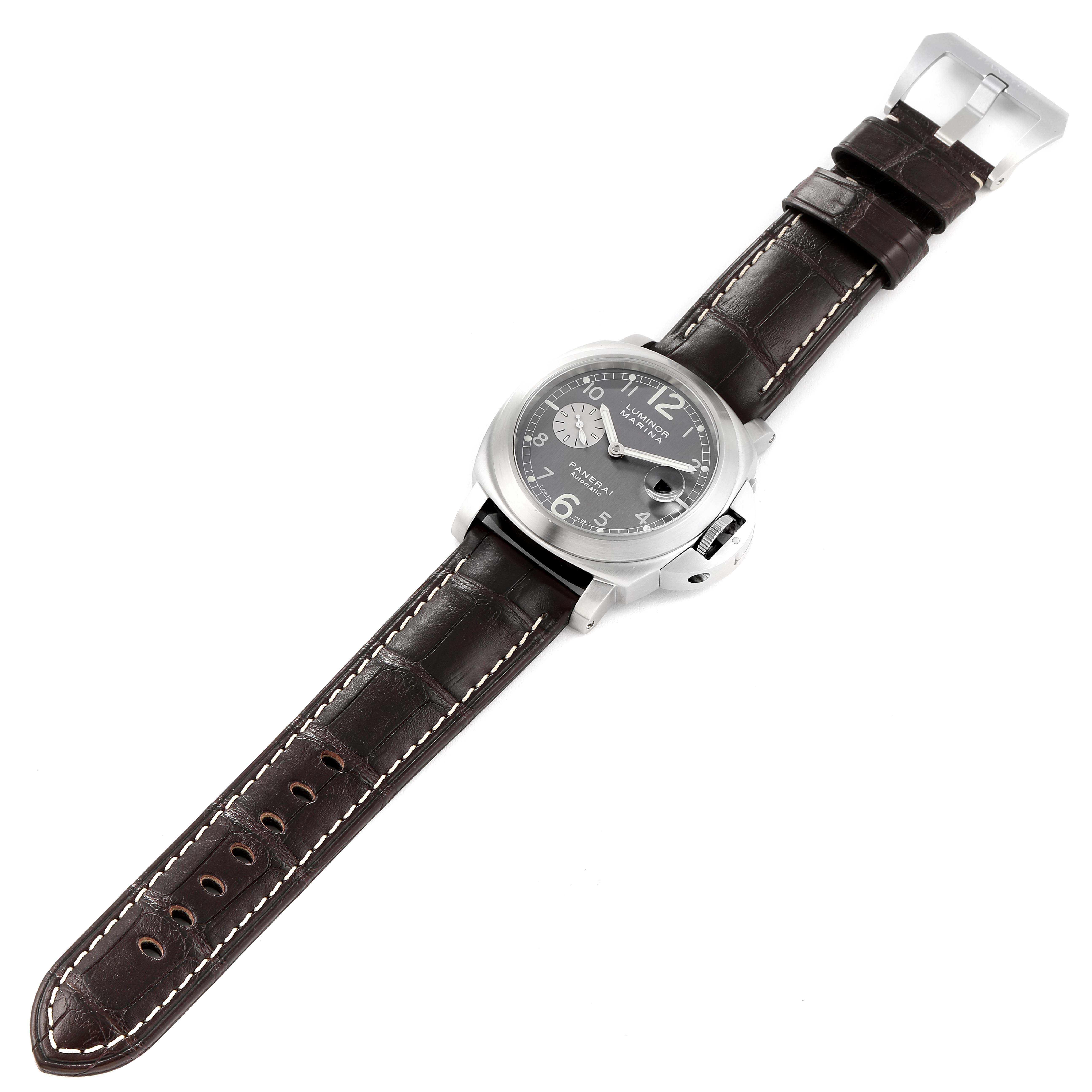 The image shows a top-down view of a Panerai Luminor PAM00086 Men
s Stainless Steel Black Dial PAM00086 Men
s Stainless Steel Black Dial watch with a brown leather strap.