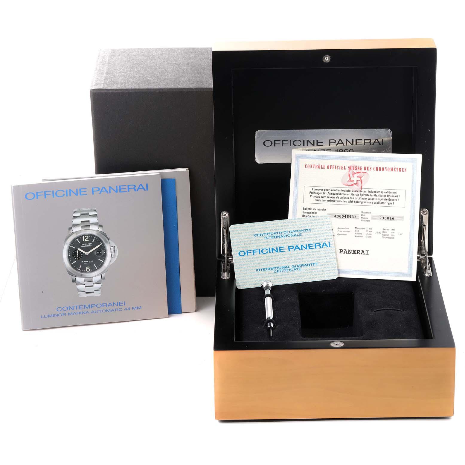 The image shows the Panerai Luminor PAM00086 Men
s Stainless Steel Black Dial PAM00086 Men
s Stainless Steel Black Dial watch box, international guarantee certificate, manual, and a tool.