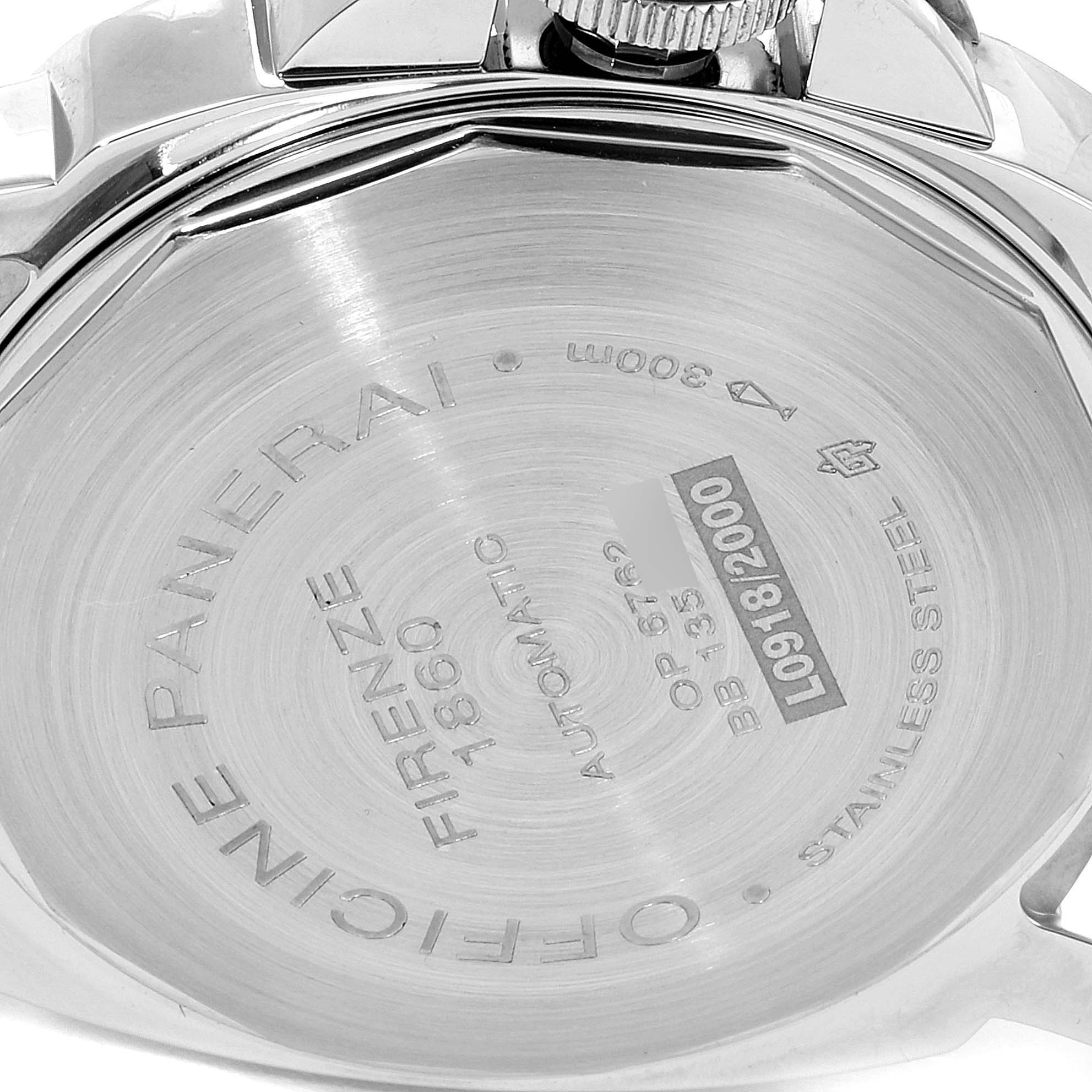 The image shows the back case of a Panerai Luminor PAM00090 Men
s Stainless Steel Black Dial PAM00090 Men
s Stainless Steel Black Dial watch, featuring engraved details and a visible crown.