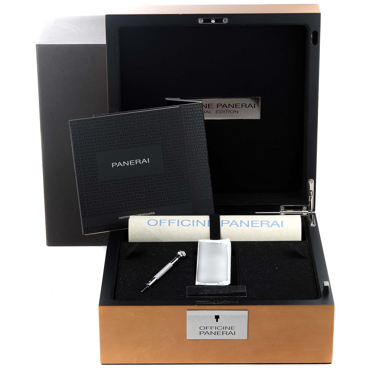 The image shows the open packaging of a Panerai Radiomir PAM00790 Men's Stainless Steel Black Dial PAM00790 Men's Stainless Steel Black Dial watch with documents, a scroll, and a tool inside.