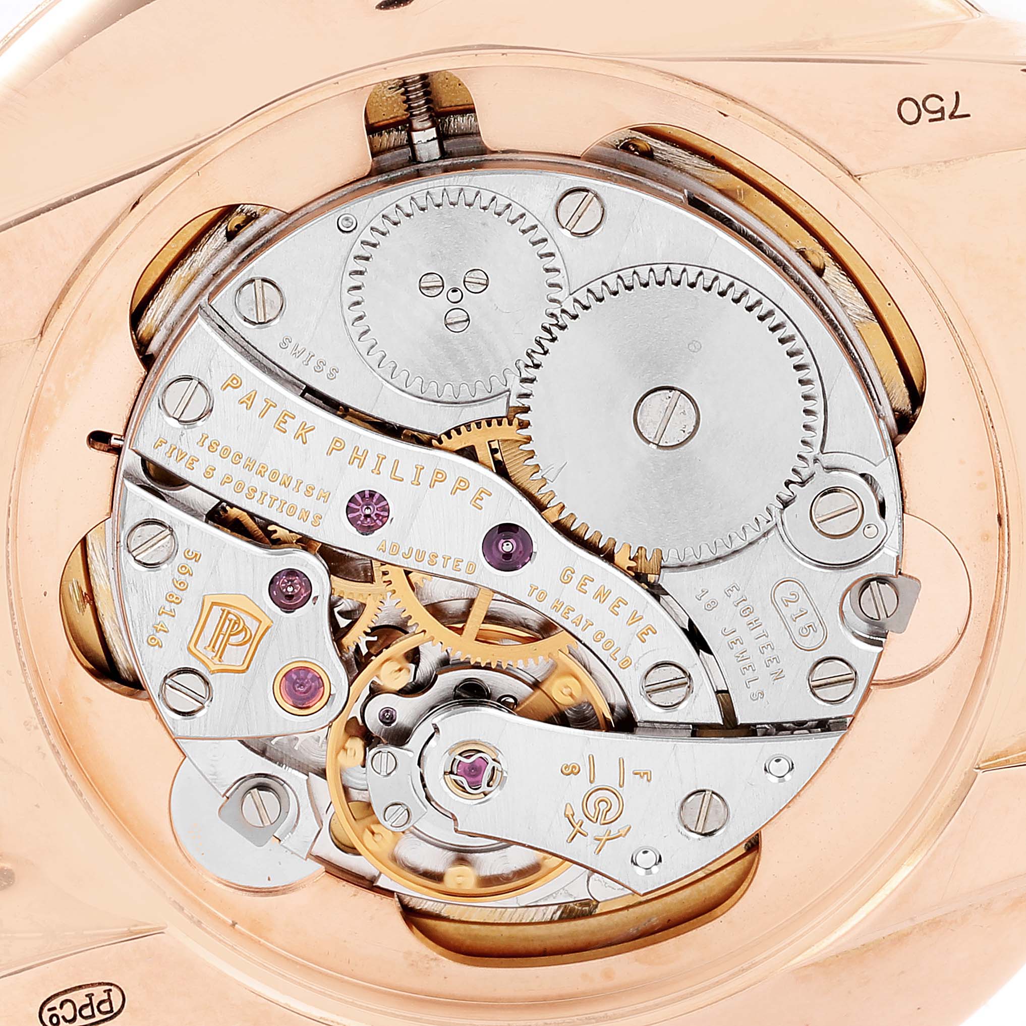 This is a close-up of the movement mechanism of a Patek Philippe Calatrava 5123R-001 Men's Rose Gold Silver Dial 5123R-001 Men's Rose Gold Silver Dial watch, showing its intricate gears and components.