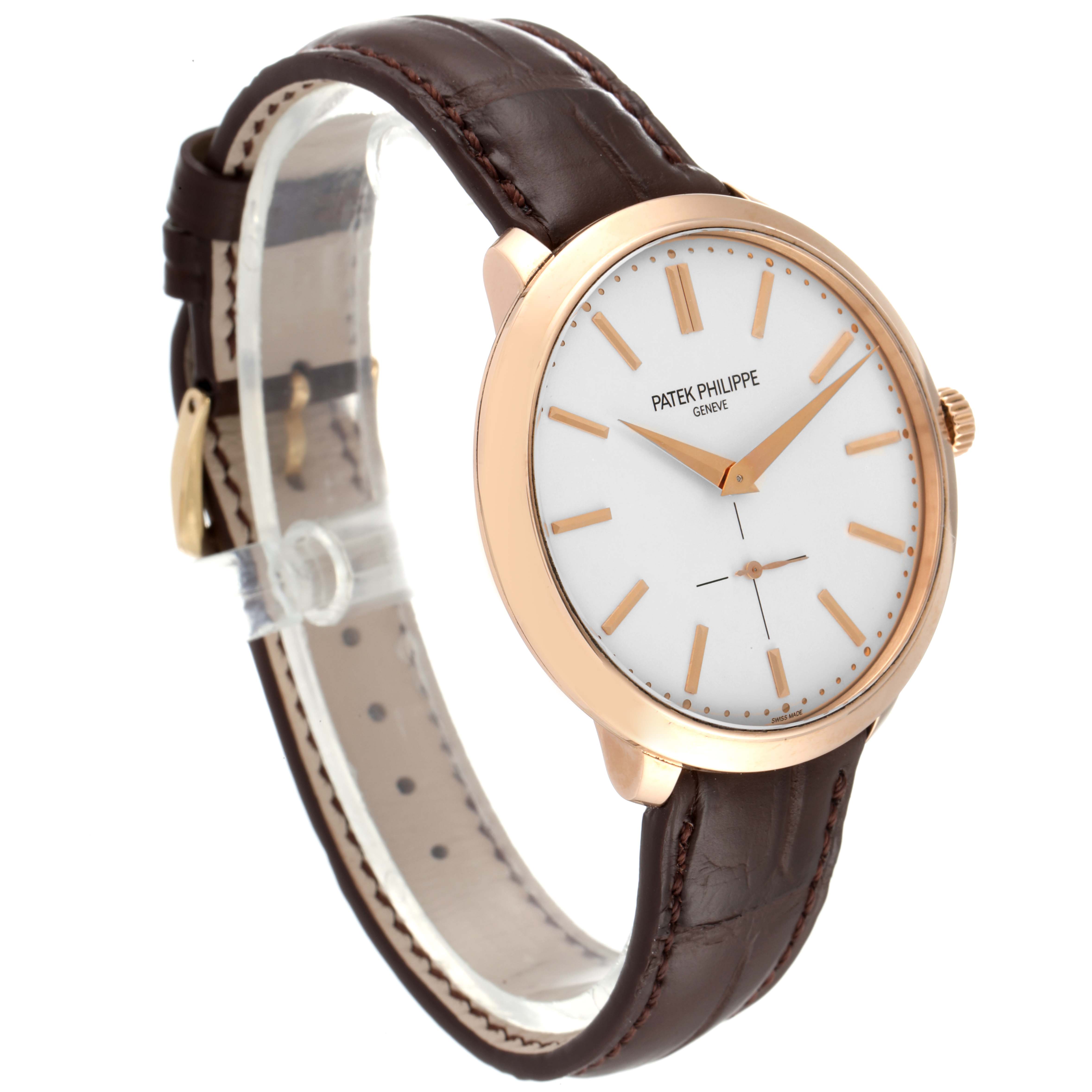 This Patek Philippe Calatrava 5123R-001 Men's Rose Gold Silver Dial 5123R-001 Men's Rose Gold Silver Dial watch is shown from an angled side view, highlighting the face, case, crown, and leather strap.
