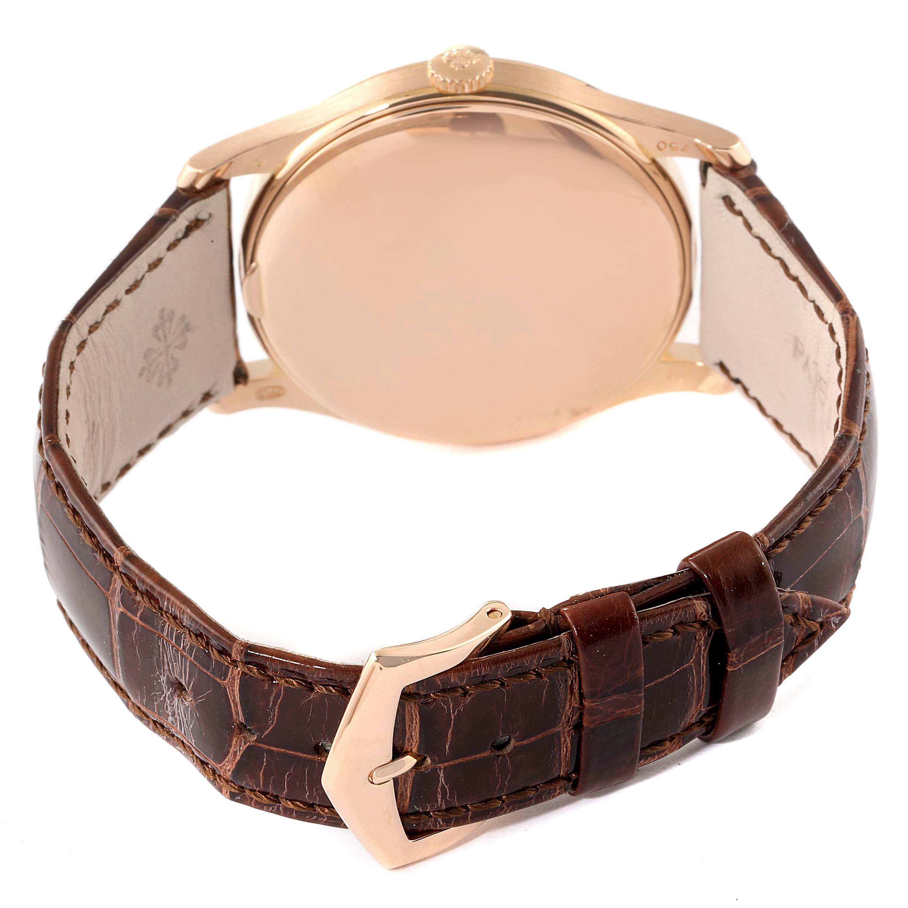 The image shows the back view of a Patek Philippe Calatrava 5196R Men's Rose Gold Silver Dial 5196R Men's Rose Gold Silver Dial watch, highlighting its leather strap and buckle.